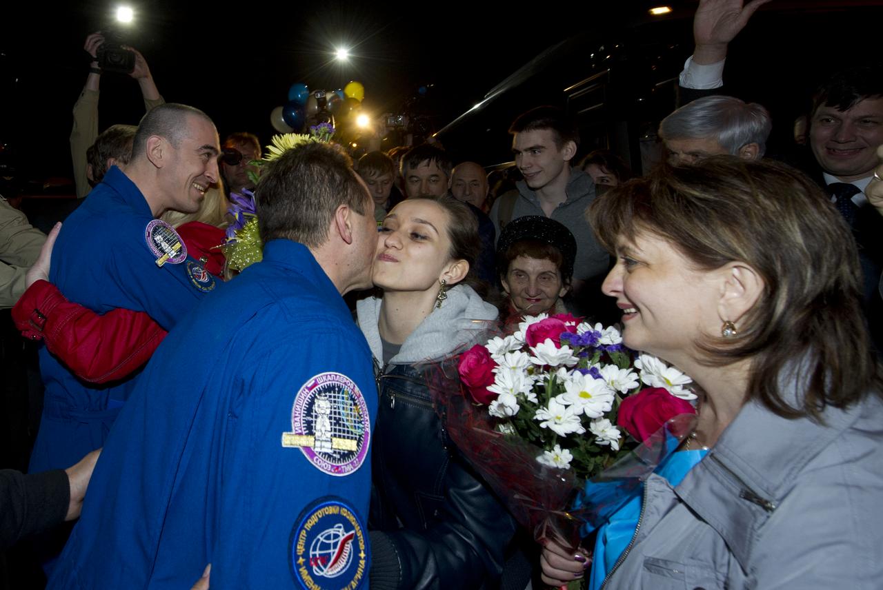 Expedition 30 Flight Engineers Anatoly Ivanishin, far left, and Anton Shkaplerov are welcomed home by colleagues and family in Star City, Russia on Saturday, April 28, 2012.  Russian Cosmonauts Ivanishin, Shkaplerov and Expedition 30 Commander Daniel Burbank landed outside of Arkalyk, Kazakhstan earlier in the day from over five months onboard the International Space Station where they served as members of the Expedtion 29 and 30 crews. Photo Credit: (NASA/Carla Cioffi)