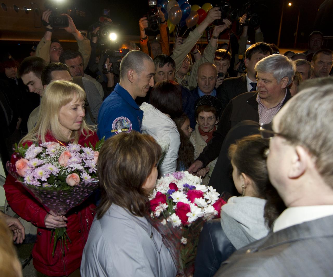 Expedition 30 Flight Engineer Anatoly Ivanishin is welcomed home by colleagues and family in Star City, Russia on Saturday, April 28, 2012.  Russian Cosmonaut Ivanishin, Expedition 30 Commander Daniel Burbank, and Russian Cosmonaut Anton Shkaplerov landed outside of Arkalyk, Kazakhstan earlier in the day from over five months onboard the International Space Station where they served as members of the Expedtion 29 and 30 crews. Photo Credit: (NASA/Carla Cioffi)