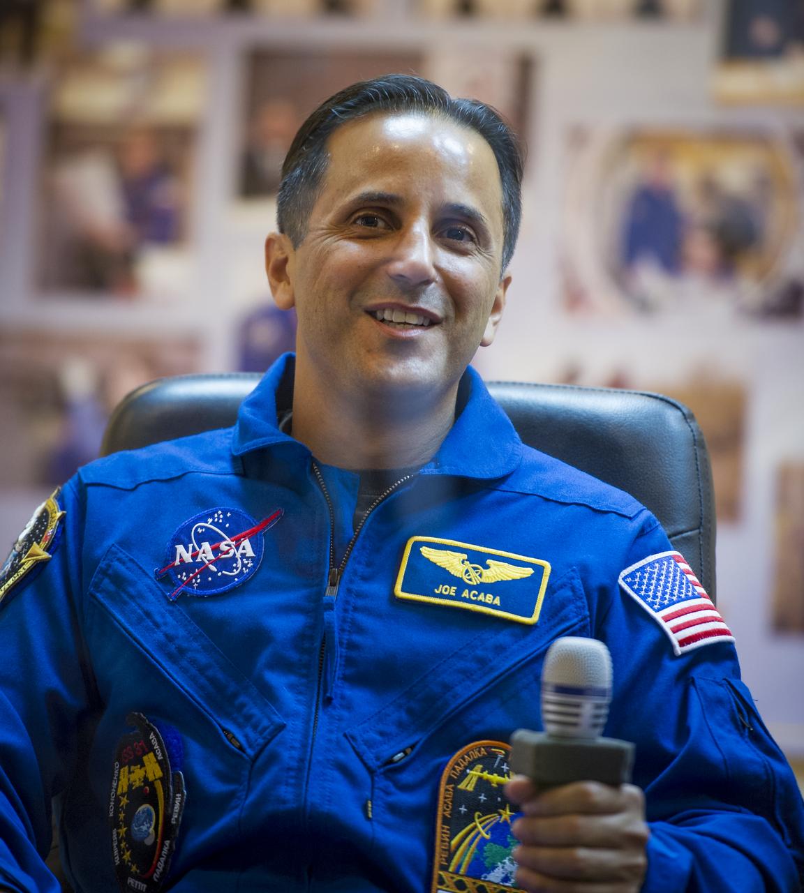 Quarantined Expedition 31 Flight Engineer Joe Acaba answers reporters questions from behind glass during a prelaunch press conference held at the Cosmonaut Hotel on Monday, May 14, 2012 in Baikonur, Kazakhstan.  The launch of the Soyuz spacecraft with Acaba, Soyuz Commander Gennady Padalka, and Flight Engineer Sergei Revin is scheduled for 9:01 a.m. local time on Tuesday, May 15.  Photo Credit (NASA/Bill Ingalls)