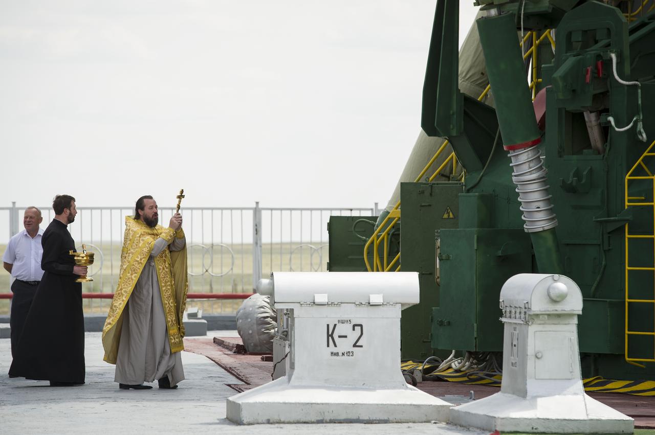 An Orthodox priest blesses the Soyuz rocket at the Baikonur Cosmodrome Launch pad on Monday, May 14, 2012 in Kazakhstan. The launch of the Soyuz spacecraft with Expedition 31 Soyuz Commander Gennady Padalka and Flight Engineer Sergei Revin of Russia, and prime NASA Flight Engineer Joe Acaba is scheduled for 9:01 a.m. local time on Tuesday, May 15.  Photo Credit (NASA/Bill Ingalls)