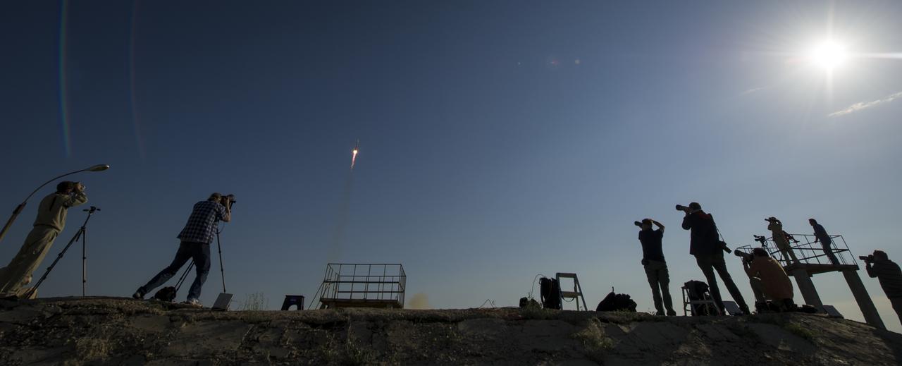 Members of the media photograph the Soyuz TMA-04M rocket launch from the Baikonur Cosmodrome in Kazakhstan on Tuesday, May 15, 2012. Heading to the International Space Station onboard the soyuz are Expedition 31 Soyuz Commander Gennady Padalka, NASA Flight Engineer Joseph Acaba and Flight Engineer Sergei Revin. Photo Credit: (NASA/Bill Ingalls)