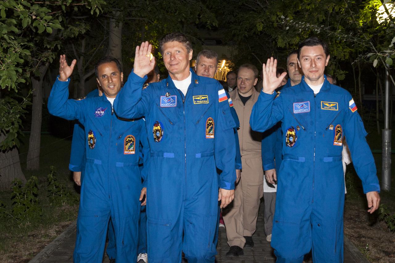 Expedition 31 crew members Joe Acaba, left, Commander Gennady Padalka and Sergei Revin, right, wave farewell as they depart the Cosmonaut Hotel on Tuesday, May 15, 2012 in Baikonur, Kazakhstan. The Soyuz spacecraft with Expedition 31 Soyuz Commander Gennady Padalka, Flight Engineer Sergei Revin, and NASA Flight Engineer Joe Acaba aboard launched at 9:01 a.m. Kazakhstan time on Tuesday, May 15. Photo Credit (NASA/Victor Zelenstov)