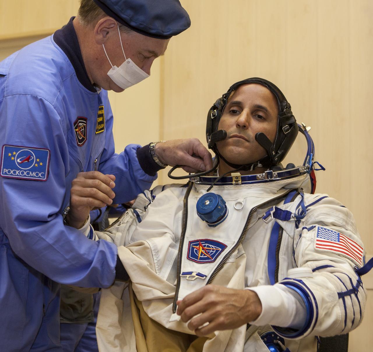 Expedition 31 Flight Engineer Joe Acaba dons his Russian Sokol suit in preparation for his launch onboard the Soyuz TMA-04M on Tuesday, May 15, 2012 at the Baikonur Cosmodrome in Kazakhstan. The Soyuz spacecraft with Acaba, Expedition 31 Soyuz Commander Gennady Padalka, and Flight Engineer Sergei Revin onboard, launched at 9:01 a.m. Kazakhstan time on Tuesday, May 15.  Photo Credit: (NASA/GCTC/Andrey Shelepin)