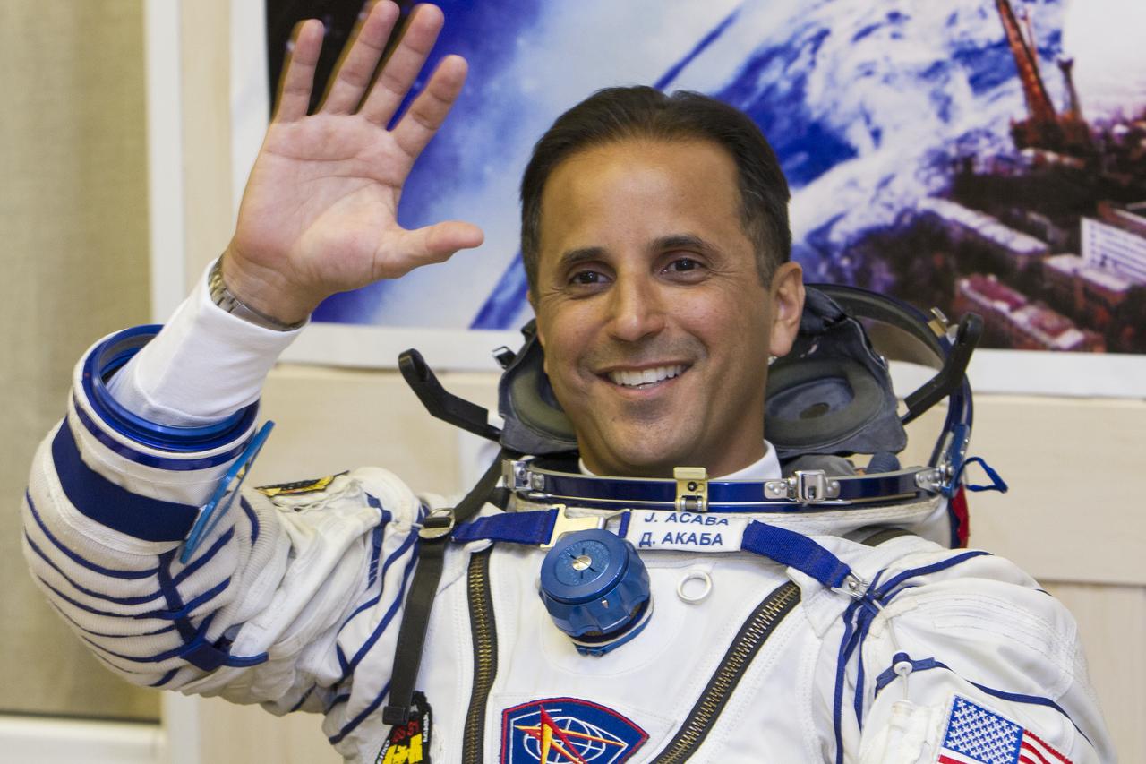 Expedition 31 Flight Engineer Joe Acaba waves to family and friends as he waits to have his Russian Sokol suit pressure checked prior to his launch onboard the Soyuz TMA-04M on Tuesday, May 15, 2012 at the Baikonur Cosmodrome in Kazakhstan. The Soyuz spacecraft with Acaba, Expedition 31 Soyuz Commander Gennady Padalka, and Flight Engineer Sergei Revin onboard, launched at 9:01 a.m. Kazakhstan time on Tuesday, May 15.  Photo Credit: (NASA/GCTC/Andrey Shelepin)