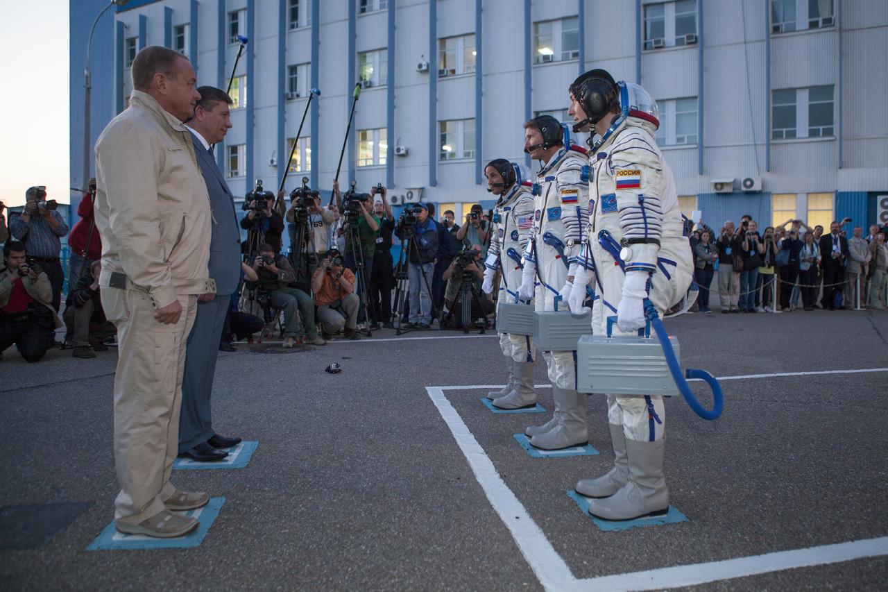 Expedition 31 Flight Engineer Joe Acaba, left, Soyuz Commander Gennady Padalka, and, Flight Engineer Sergei Revin, right, receive a formal go for launch from Vitaly Alexandrovich Lopota, President of Energia, left, and Vladimir Popovkin, Director of Roscosmos prior to their launch onboard the Soyuz TMA-04M on Tuesday, May 15, 2012 at the Baikonur Cosmodrome in Kazakhstan. The Soyuz spacecraft with Padalka, Revin, and Acaba onboard, launched at 9:01 a.m. Kazakhstan time on Tuesday, May 15.  Photo Credit: (NASA/GCTC/Andrey Shelepin)