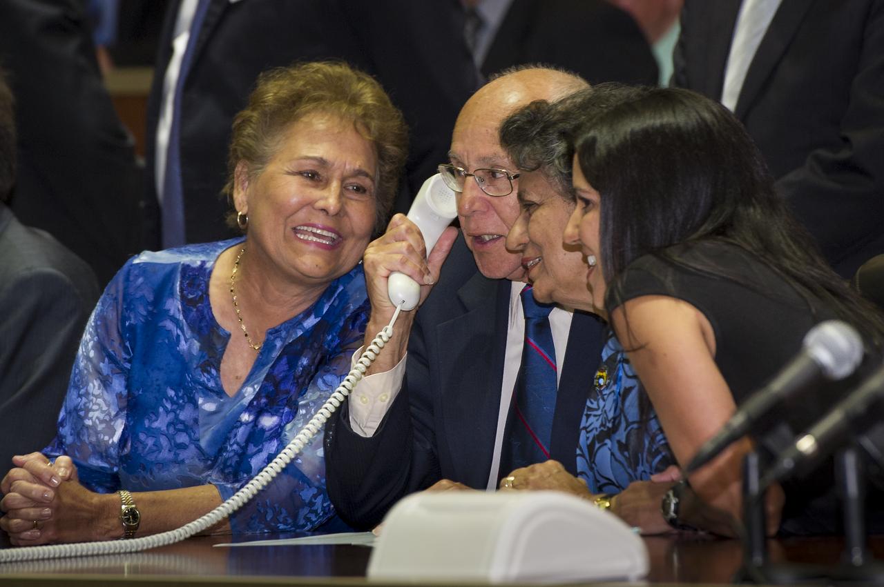 The family of Expedition 31 Flight Engineer Joe Acaba sings happy birthday to him from the Russian Mission Control Center in Korolev, Russia, Thursday, May 17, 2012. Acaba, Expedition 31 Soyuz Commander Gennady Padalka, and Flight Engineer Sergei Revin, docked their Soyuz TMA-04M spacecraft to the space station at 8:36 a.m. Moscow time, two days after they launched from the Baikonur Cosmodrome in Kazakhstan.  Photo Credit: (NASA/Bill Ingalls)