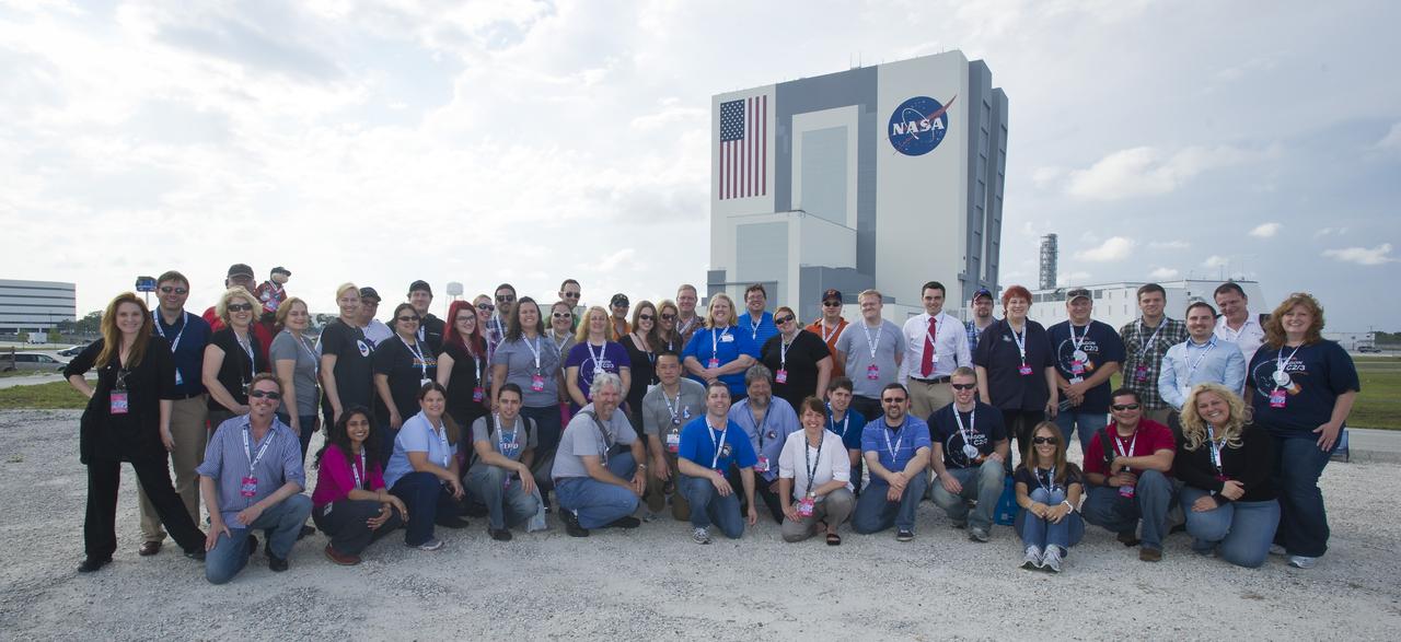 Participants with the NASA Social stand together, Friday, May 18, 2012, in front of the Vehicle Assembly Building (VAB) at Kennedy Space Center in Cape Canaveral, Fla. About 50 NASA Social followers attended an event as part of activities surrounding the launch of Space Exploration Technologies, or SpaceX, demonstration mission of the company's Falcon 9 rocket to the International Space Station. Photo Credit: (NASA/Paul E. Alers)