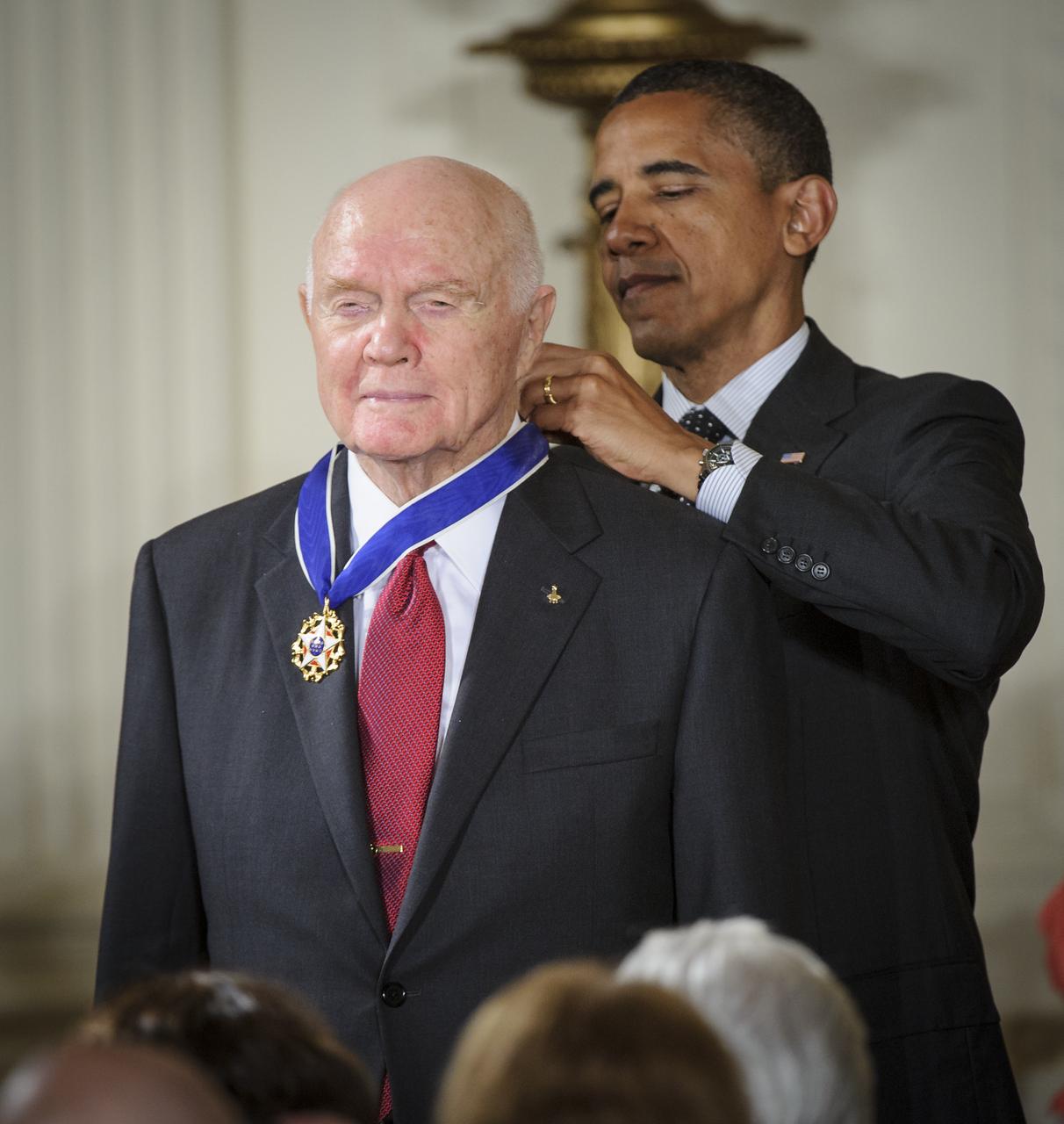 President Barack Obama presents former United States Marine Corps pilot, astronaut, and United States Senator John Glenn with a Medal of Freedom, Tuesday, May 29, 2012, during a ceremony at the White House in Washington. Photo Credit: (NASA/Bill Ingalls)