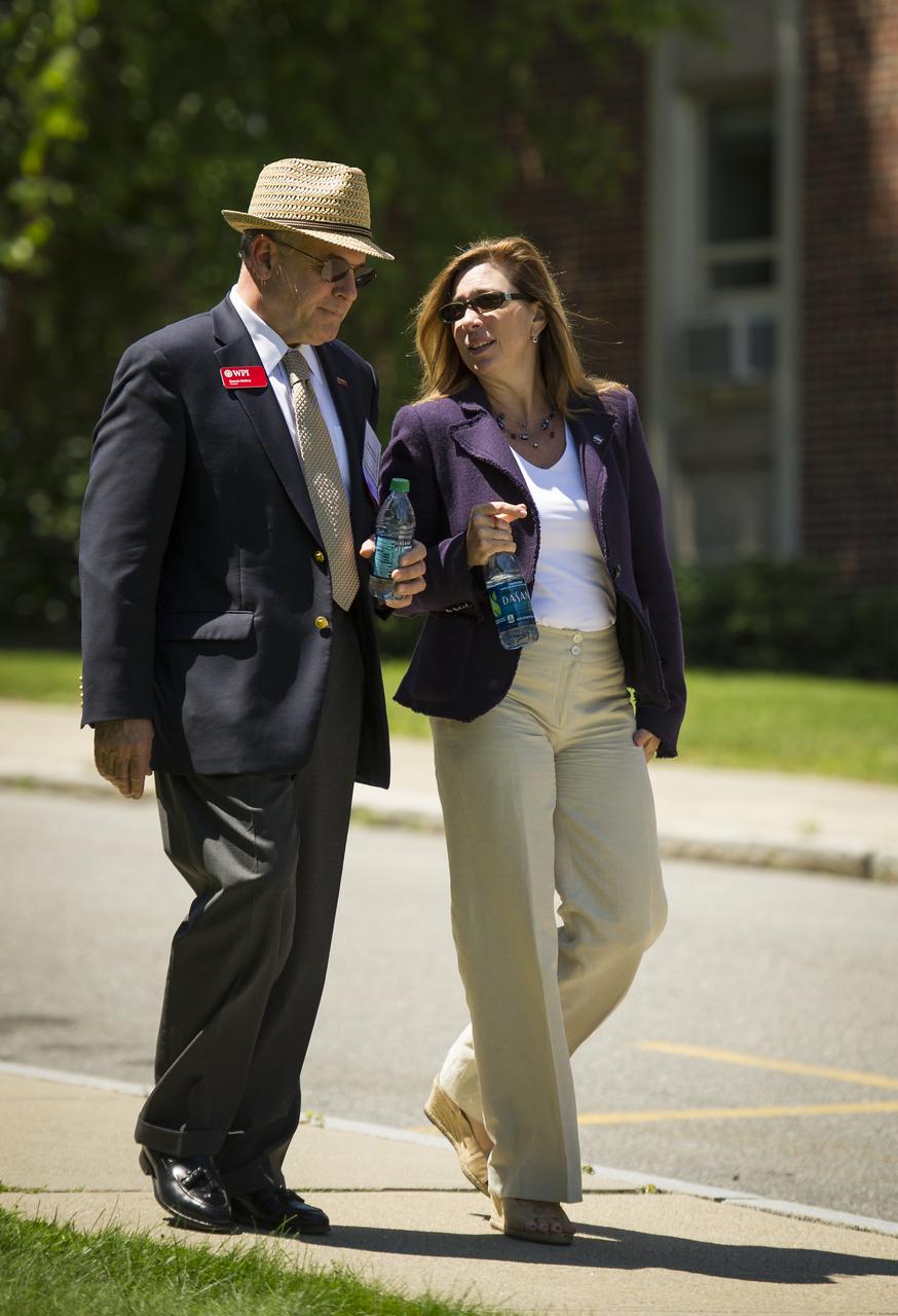 Worcester Polytechnic Institute (WPI) President Dennis Berkey, left, walks with NASA Deputy Administrator Lori Garver to the competition field for the NASA-WPI Sample Return Robot Centennial Challenge on Saturday, June 16, 2012 at the Worcester Polytechnic Institute (WPI) in Worcester, Mass. Teams were challenged to build autonomous robots that can identify, collect and return samples.  NASA needs autonomous robotic capability for future planetary exploration. Photo Credit: (NASA/Bill Ingalls)