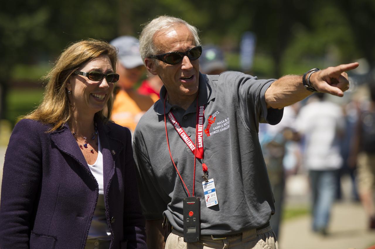 NASA Deputy Administrator Lori Garver, left, listens as Worcester Polytechnic Institute (WPI) Robotics Resource Center Director and NASA-WPI Sample Return Robot Centennial Challenge Judge Ken Stafford points out how the robots navigate the playing field during the challenge on Saturday, June 16, 2012 in Worcester, Mass. Teams were challenged to build autonomous robots that can identify, collect and return samples.  NASA needs autonomous robotic capability for future planetary exploration. Photo Credit: (NASA/Bill Ingalls)