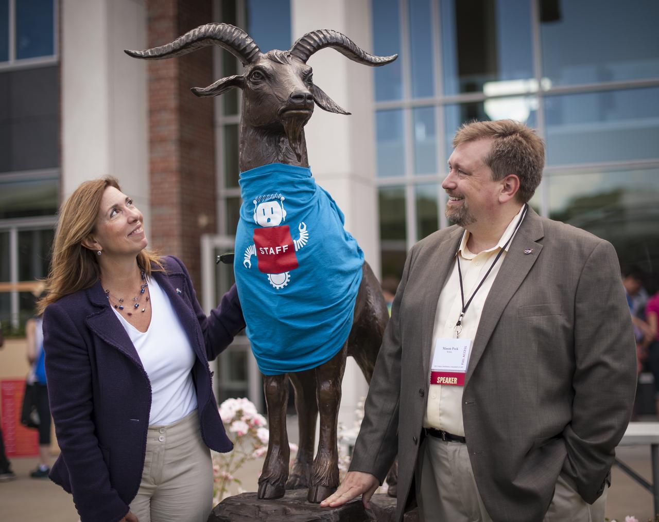 NASA Deputy Administrator Lori Garver and NASA Chief Technologist Mason Peck stop to look at the bronze statue of the goat mascot for Worcester Polytechnic Institute (WPI) named "Gompei" that is wearing a staff t-shirt for the "TouchTomorrow" education and outreach event that was held in tandem with the NASA-WPI Sample Return Robot Centennial Challenge on Saturday, June 16, 2012 in Worcester, Mass. The challenge tasked robotic teams to build autonomous robots that can identify, collect and return samples. NASA needs autonomous robotic capability for future planetary exploration. Photo Credit: (NASA/Bill Ingalls)