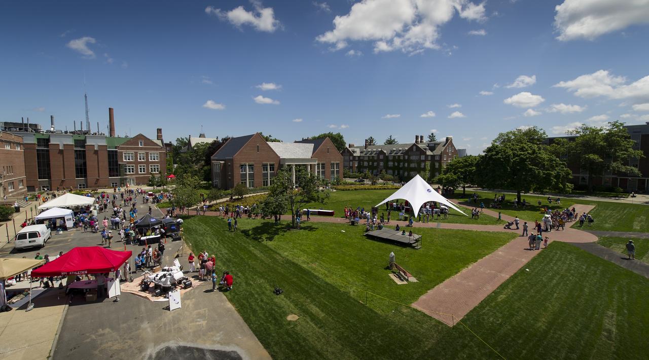 Panoramic of some of the exhibits available on the campus of the Worcester Polytechnic Institute (WPI) during their "TouchTomorrow" education and outreach event that was held in tandem with the NASA-WPI Sample Return Robot Centennial Challenge on Saturday, June 16, 2012 in Worcester, Mass. The NASA-WPI challenge tasked robotic teams to build autonomous robots that can identify, collect and return samples. NASA needs autonomous robotic capability for future planetary exploration. Photo Credit: (NASA/Anthony Shrout)