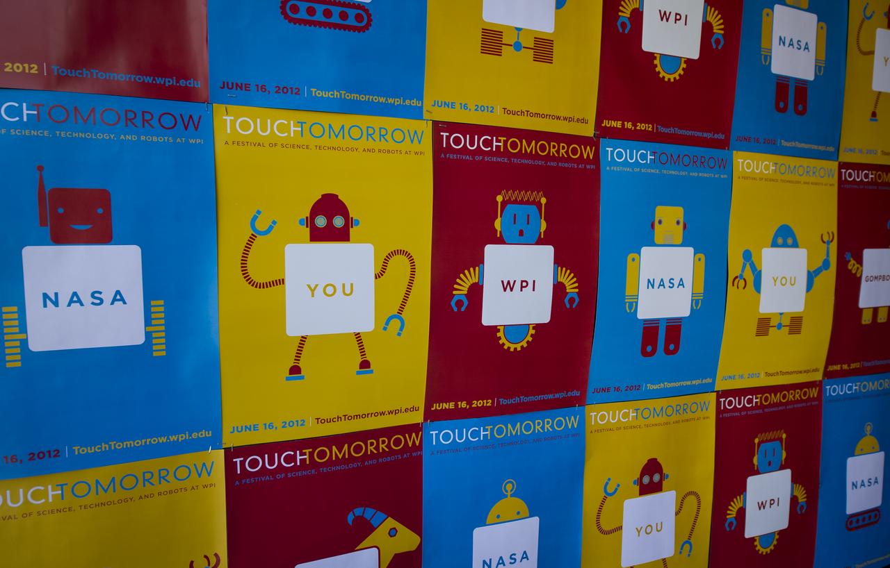 Posters for the Worcester Polytechnic Institute (WPI) "TouchTomorrow" education and outreach event are seen posted around the campus on Saturday, June 16, 2012 at WPI in Worcester, Mass. The TouchTomorrow event was held in tandem with the NASA-WPI Sample Return Robot Centennial Challenge. The NASA-WPI challenge tasked robotic teams to build autonomous robots that can identify, collect and return samples. NASA needs autonomous robotic capability for future planetary exploration. Photo Credit: (NASA/Bill Ingalls)