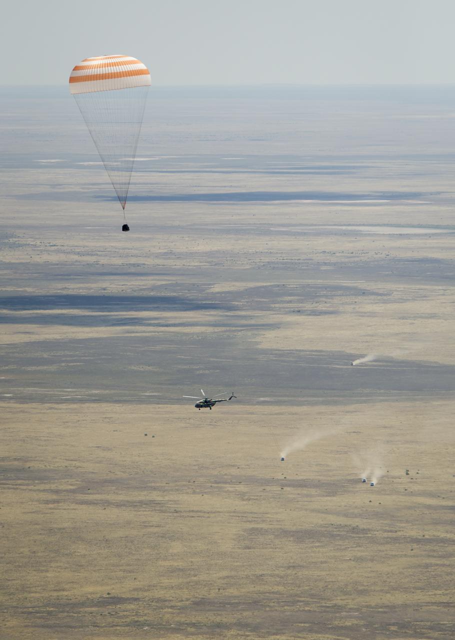 The Soyuz TMA-03M spacecraft is seen as it lands with Expedition 31 Commander Oleg Kononenko of Russia and Flight Engineers Don Pettit of NASA and Andre Kuipers of the European Space Agency in a remote area near the town of Zhezkazgan, Kazakhstan, on Sunday, July 1, 2012.  Pettit, Kononenko and Kuipers returned from more than six months onboard the International Space Station where they served as members of the Expedition 30 and 31 crews. Photo Credit: (NASA/Bill Ingalls)