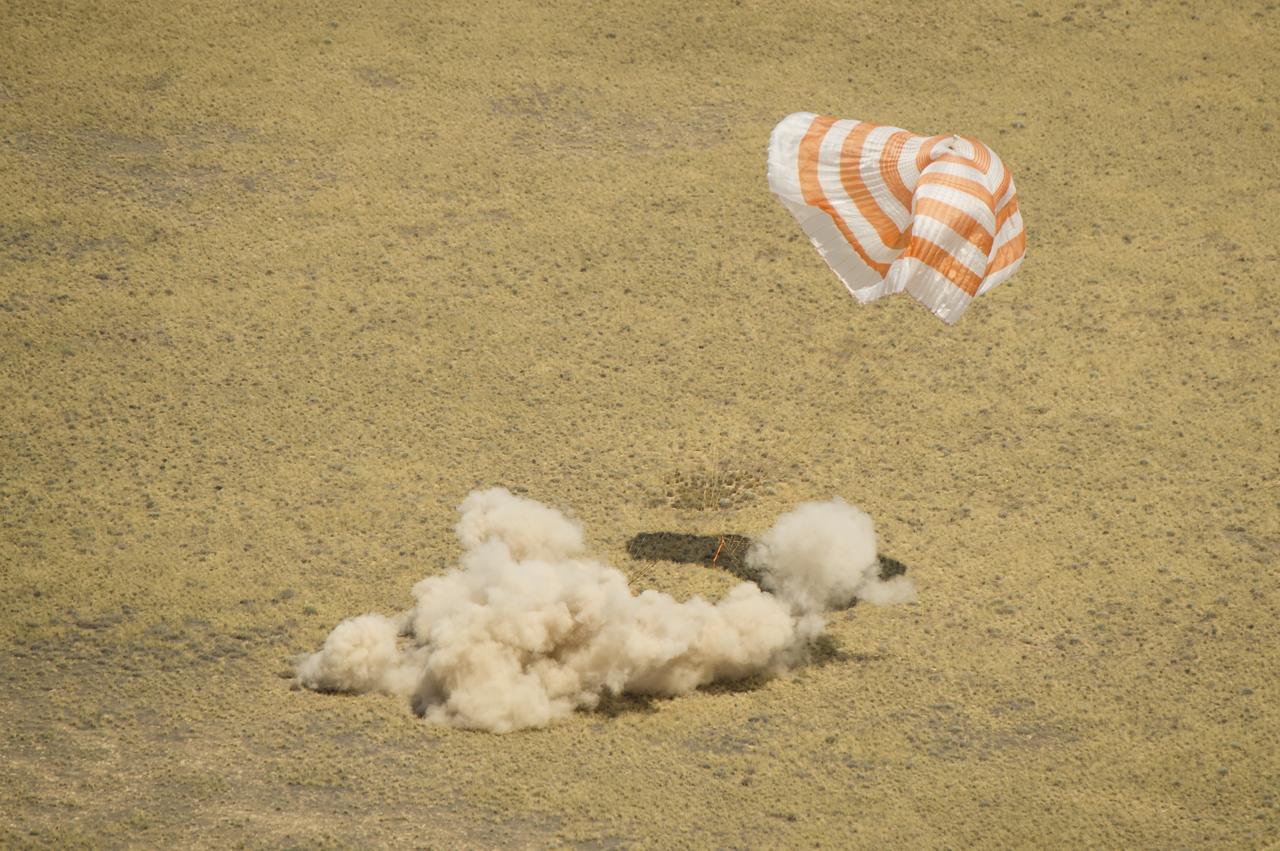 The Soyuz TMA-03M spacecraft is seen as it lands with Expedition 31 Commander Oleg Kononenko of Russia and Flight Engineers Don Pettit of NASA and Andre Kuipers of the European Space Agency in a remote area near the town of Zhezkazgan, Kazakhstan, on Sunday, July 1, 2012.  Pettit, Kononenko and Kuipers returned from more than six months onboard the International Space Station where they served as members of the Expedition 30 and 31 crews. Photo Credit: (NASA/Bill Ingalls)