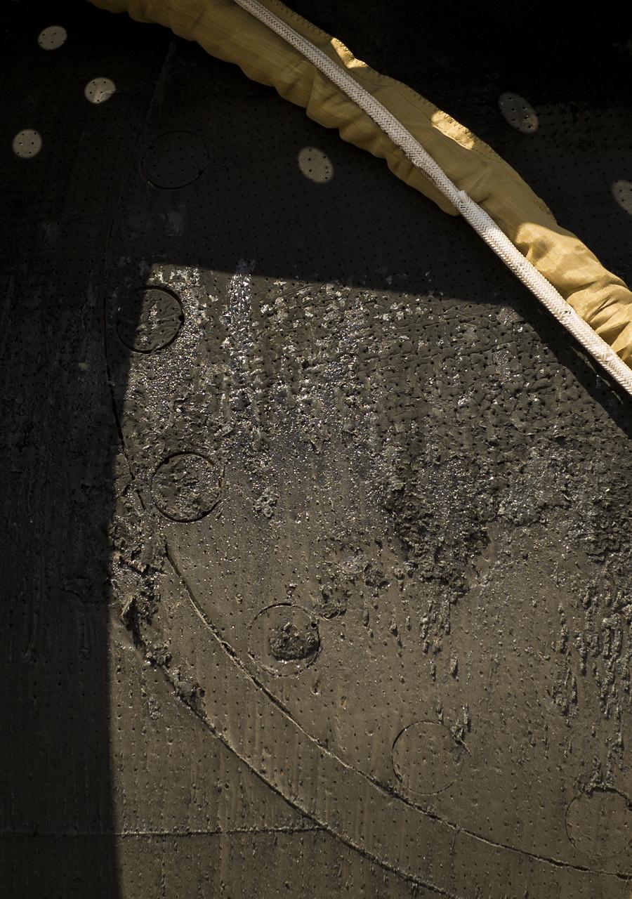 A closely cropped image of the Soyuz capsule shows the charring that took place during reentry of the Soyuz TMA-03M capsule after it landed with Expedition 31 Commander Oleg Kononenko of Russia and Flight Engineers Don Pettit of NASA and Andre Kuipers of the European Space Agency in a remote area near the town of Zhezkazgan, Kazakhstan, on Sunday, July 1, 2012. Pettit, Kononenko and Kuipers returned from more than six months onboard the International Space Station where they served as members of the Expedition 30 and 31 crews. Photo Credit: (NASA/Bill Ingalls)