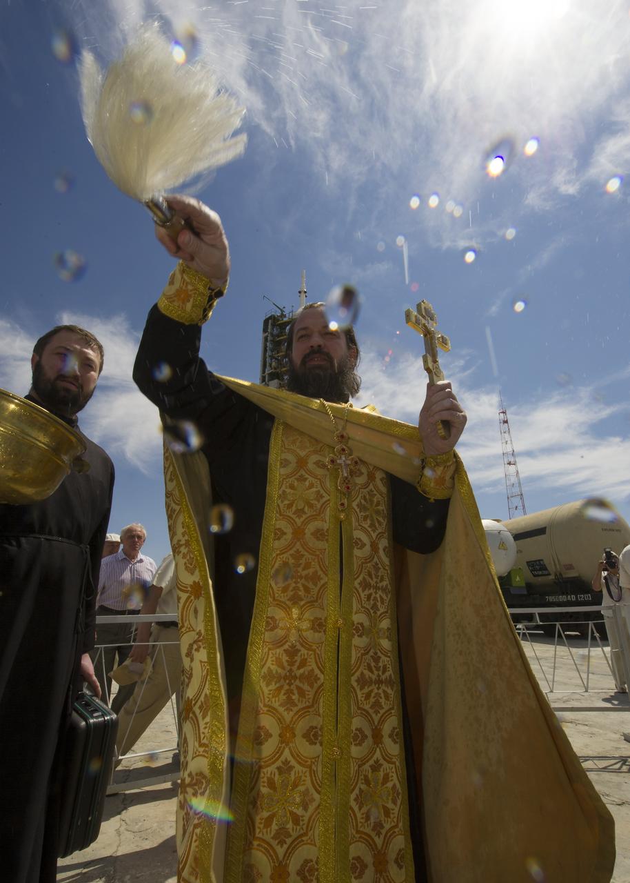 An Orthodox priest blesses members of the media shortly after blessing the Soyuz rocket at the Baikonur Cosmodrome Launch pad on Friday, July 13, 2012 in Kazakhstan. The launch of the Soyuz spacecraft with Expedition 32 Soyuz Commander Yuri Malenchenko, NASA Flight Engineer Sunita Williams and JAXA (Japan Aerospace Exploration Agency) Flight Engineer Akihiko Hoshide is scheduled for the morning of Sunday, July 15, local time. Photo Credit: (NASA/Carla Cioffi)