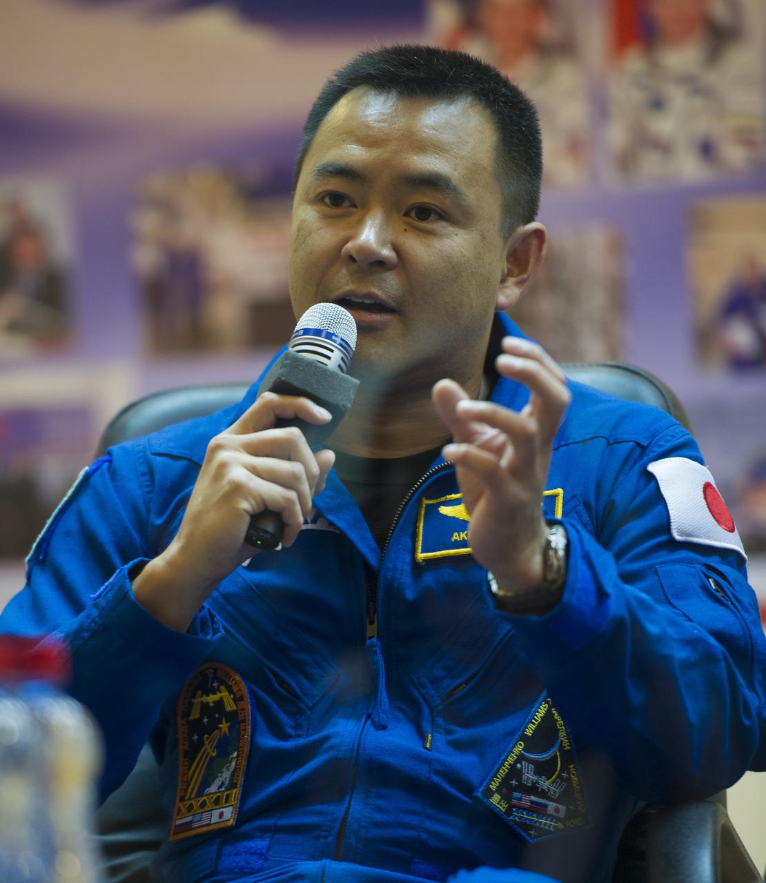 Quarantined Expedition 32 JAXA (Japan Aerospace Exploration Agency) Flight Engineer Akihiko Hoshide answers reporters questions from behind glass during a prelaunch press conference held at the Cosmonaut Hotel on Friday, July 13, 2012 in Baikonur, Kazakhstan.  The launch of the Soyuz spacecraft with Hoshide, Soyuz Commander Yuri Malenchenko, and NASA Flight Engineer Sunita Williams is scheduled for 8:40 a.m. local time on Sunday, July 15.  Photo Credit (NASA/Carla Cioffi)
