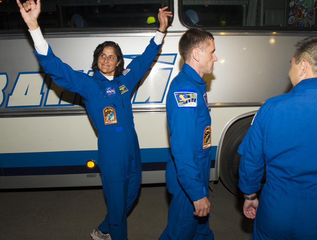 Expedition 32 NASA Flight Engineer Sunita Williams waves goodbye after leaving the Cosmonaut Hotel, Sunday, July 15, 2012 in Baikonur, Kazakhstan. The Soyuz spacecraft with Williams, Soyuz Commander Yuri Malenchenko and JAXA Flight Engineer Akihiko Hoshide aboard launched at 8:40 a.m. Kazakhstan time. Photo Credit (NASA/Carla Cioffi)