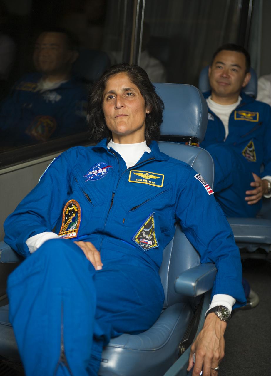 Expedition 32 NASA astronaut Sunita Williams watches a video as the crew bus departs the Cosmonaut Hotel on Sunday, July 15, 2012 in Baikonur, Kazakhstan. The launch of the Soyuz spacecraft with Williams, Soyuz Commander Yuri Malenchenko and JAXA Flight Engineer Akihiko Hoshide is scheduled for 8:40 a.m. local time on Sunday, July 15.  Photo Credit: (NASA/GCTC/Irina Peshkova)
