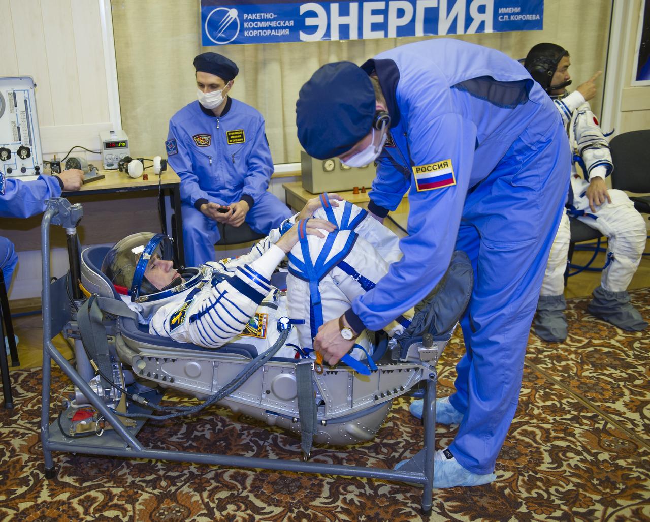 Expedition 32 Soyuz Commander Yuri Malenchenko lies in a chair to have his Russian Sokol suit pressure checked in preparation for his launch onboard the Soyuz TMA-05M on Sunday, July 15, 2012 at the Baikonur Cosmodrome in Kazakhstan. The launch of the Soyuz spacecraft with Malenchenko, NASA Flight Engineer Sunita Williams and JAXA (Japan Aerospace Exploration Agency) Flight Engineer Akihiko Hoshide is scheduled for the morning of Sunday, July 15, local time. Photo Credit: (NASA/GCTC/Irina Peshkova)