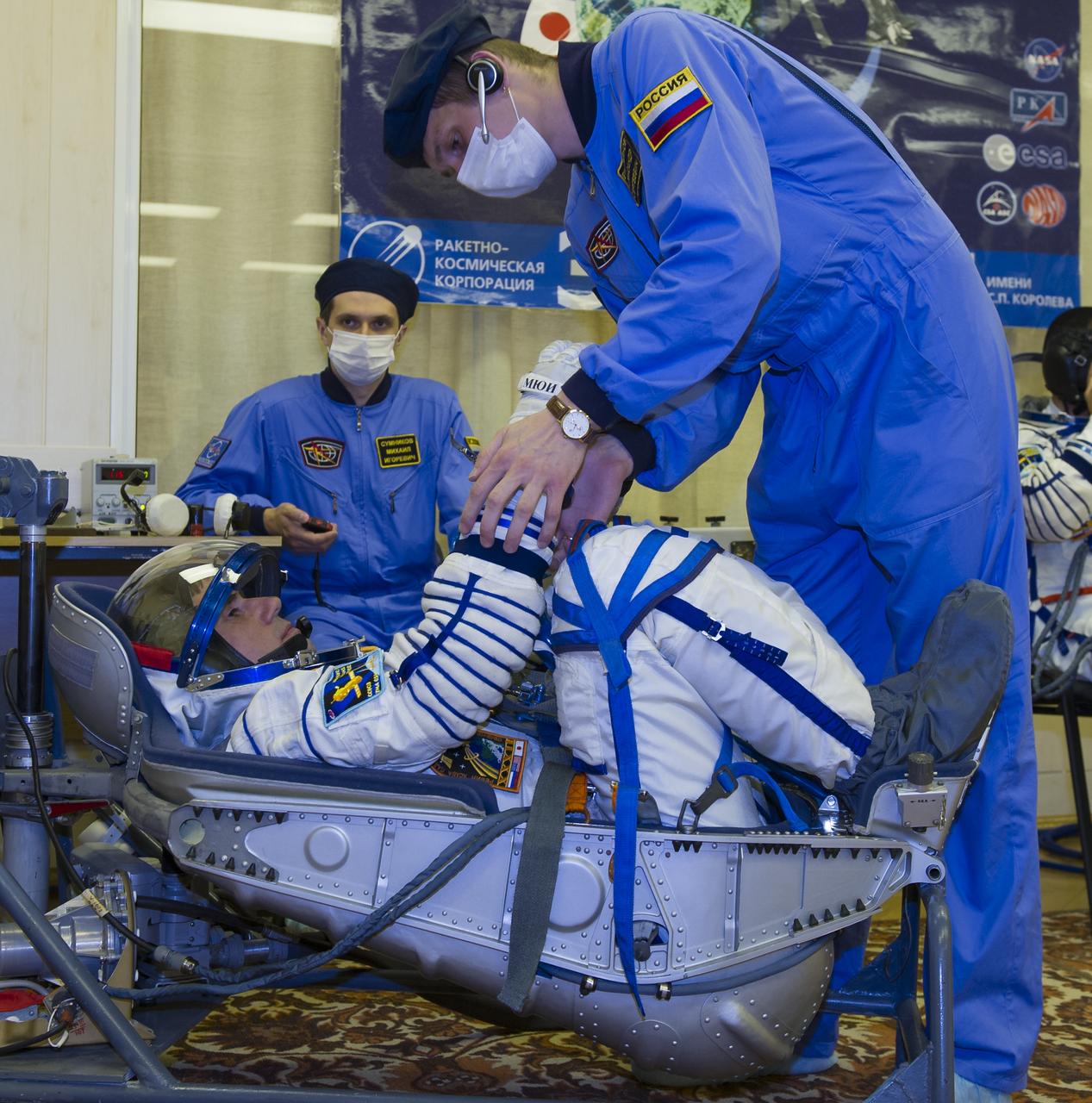 Expedition 32 Soyuz Commander Yuri Malenchenko lies in a chair to have his Russian Sokol suit pressure checked in preparation for his launch onboard the Soyuz TMA-05M on Sunday, July 15, 2012 at the Baikonur Cosmodrome in Kazakhstan. The launch of the Soyuz spacecraft with Malenchenko, NASA Flight Engineer Sunita Williams and JAXA (Japan Aerospace Exploration Agency) Flight Engineer Akihiko Hoshide is scheduled for the morning of Sunday, July 15, local time. Photo Credit: (NASA/GCTC/Irina Peshkova)