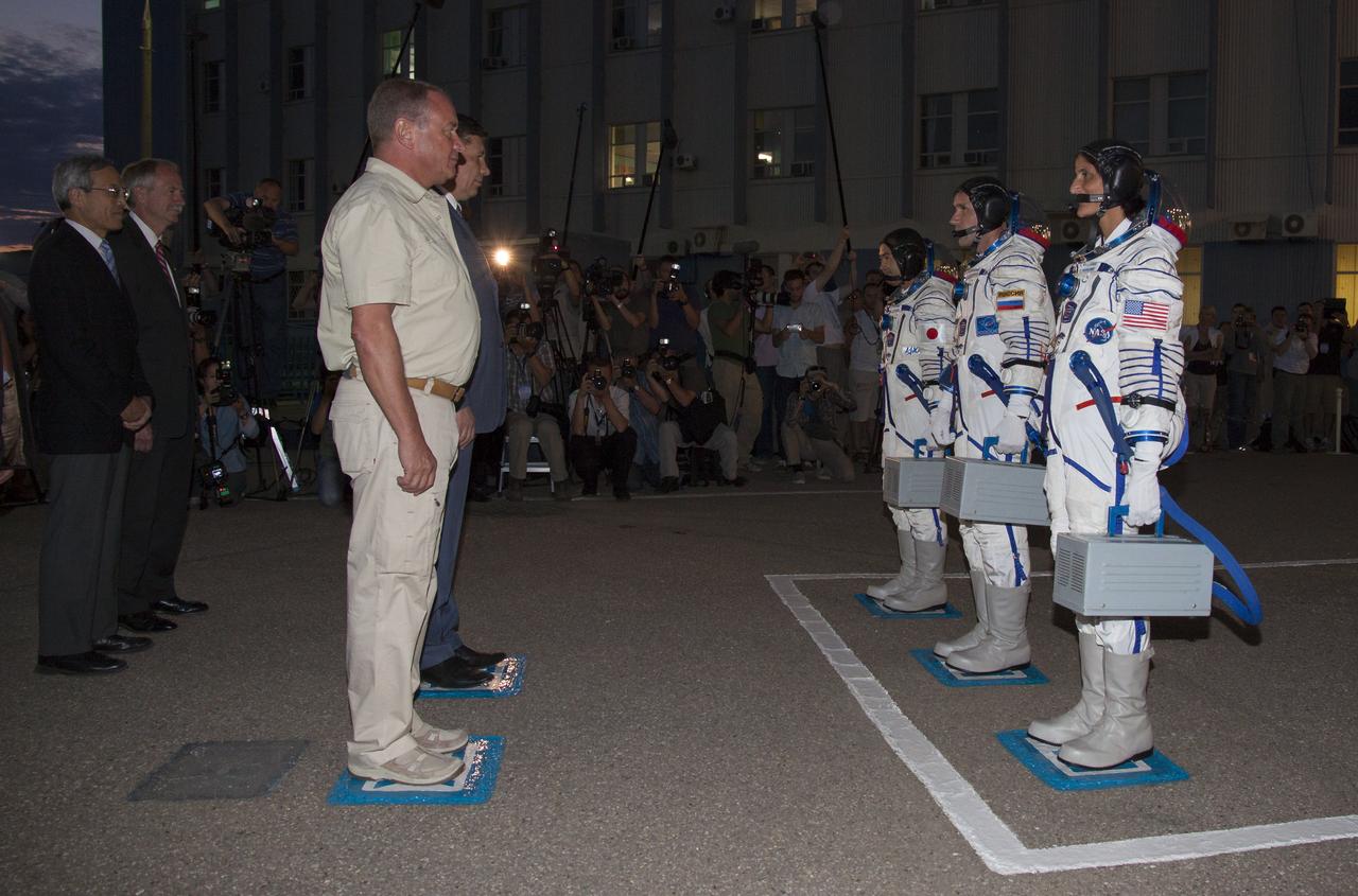 Expedition 32 Flight Engineer Sunita Williams, right, Soyuz Commander Yuri Malenchenko and JAXA Flight Engineer Akihiko Hoshide, left, receive a formal go for launch from Vitaly Alexandrovich Lopota, President of Energia, left, and Vladimir Popovkin, Director of Roscosmos prior to their launch onboard the Soyuz TMA-05M on Sunday, July 15, 2012 at the Baikonur Cosmodrome in Kazakhstan. The Soyuz spacecraft with Malenchenko, Williams and Hoshide onboard launched at 8:40 a.m. later that morning Kazakhstan time. Photo Credit: (NASA/Victor Zelentsov)