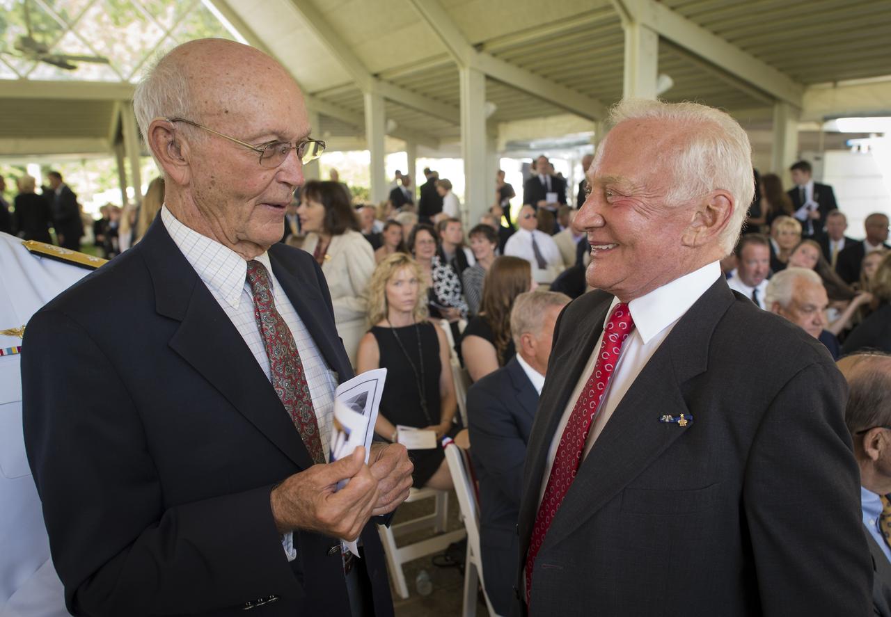 Apollo 11 Astronauts Michael Collins, left, and Buzz Aldrin talk at a private memorial service celebrating the life of Neil Armstrong, Aug. 31, 2012, at the Camargo Club in Cincinnati. Armstrong, the first man to walk on the moon during the 1969 Apollo 11 mission, died Saturday, Aug. 25. He was 82. Photo Credit: (NASA/Bill Ingalls)