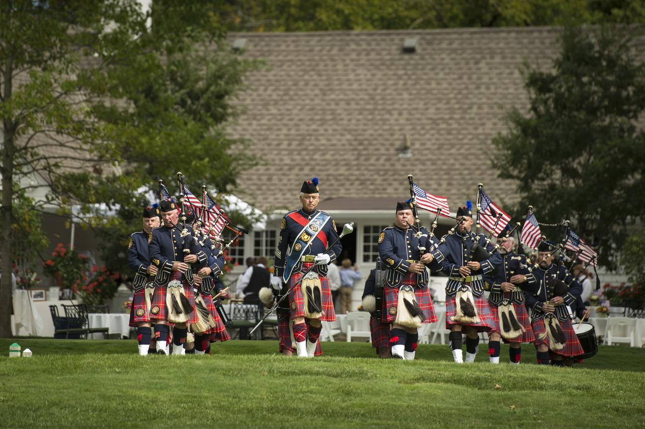 The Hamilton Co. (OH) Sheriff’s Office bagpipe corps concludes the memorial service celebrating the life of Neil Armstrong, Friday, Aug. 31, 2012, at the Camargo Club in Cincinnati. Armstrong, the first man to walk on the moon during the 1969 Apollo 11 mission, died Saturday, Aug. 25. He was 82. Photo Credit: (NASA/Bill Ingalls)