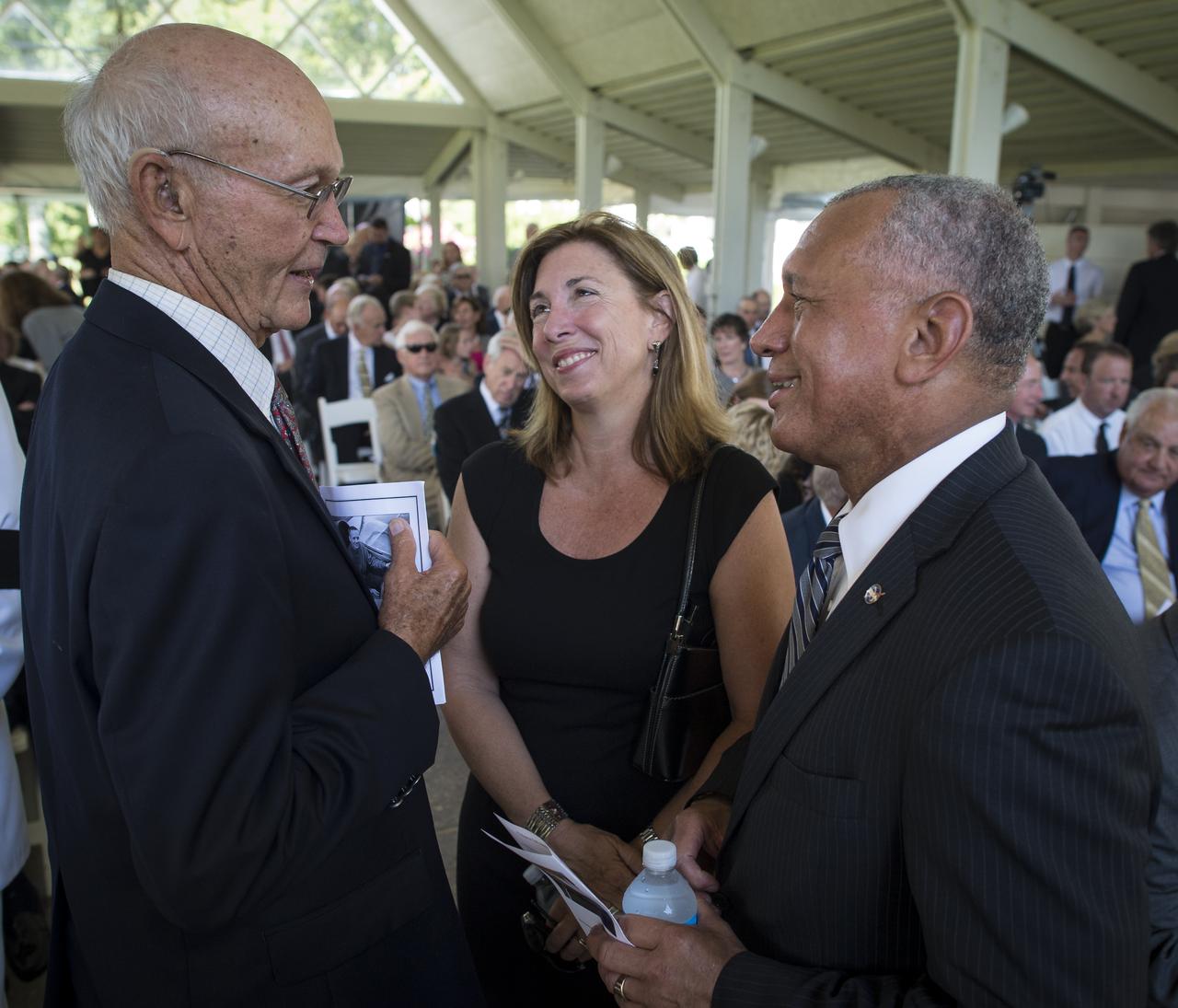 Apollo 11 Astronauts Michael Collins, left, NASA Deputy Administrator Lori Garver and NASA Administrator Charles Bolden, right, talk at a private memorial service celebrating the life of Neil Armstrong, Aug. 31, 2012, at the Camargo Club in Cincinnati. Armstrong, the first man to walk on the moon during the 1969 Apollo 11 mission, died Saturday, Aug. 25. He was 82. Photo Credit: (NASA/Bill Ingalls)