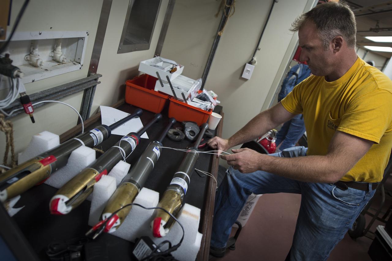 Sean Whelan, a Marine Technician for the Woods Hole Oceanographic Institution, prepares CTD instruments used to measure Conductivity, Temperature, and Depth, onboard the Institute's research vessel Knorr on Tuesday, Sept. 4, 2012, in Woods Hole, Mass. The CTDs will be deployed in the Atlantic Ocean as part of the Salinity Processes in the Upper Ocean Regional Study (SPURS) which is set to sail on Sept. 6. The NASA-sponsored expedition will sail to the North Atlantic's saltiest spot to get a detailed, 3-D picture of how salt content fluctuates in the ocean's upper layers and how these variations are related to shifts in rainfall patterns around the planet. Photo Credit: (NASA/Bill Ingalls)