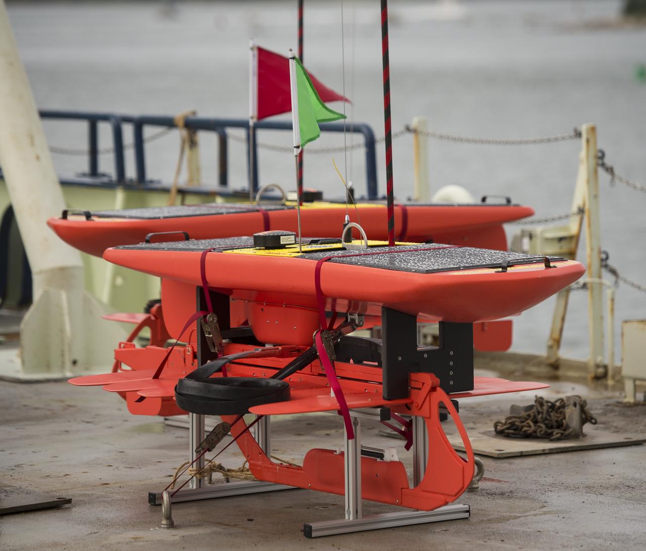 Autonomous wave gliders are seen onboard the the Woods Hole Oceanographic Institution research vessel Knorr on Tuesday, Sept. 4, 2012, in Woods Hole, Mass. The autonomous gliders will be deployed in the Atlantic Ocean as part of the Salinity Processes in the Upper Ocean Regional Study (SPURS) which is set to sail on Sept. 6. The NASA-sponsored expedition will sail to the North Atlantic's saltiest spot to get a detailed, 3-D picture of how salt content fluctuates in the ocean's upper layers and how these variations are related to shifts in rainfall patterns around the planet. Photo Credit: (NASA/Bill Ingalls)