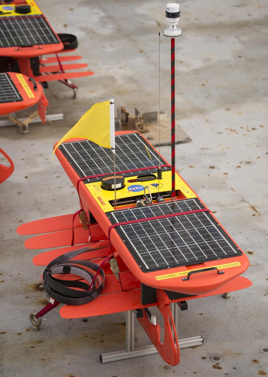 Autonomous wave gliders are seen onboard the the Woods Hole Oceanographic Institution research vessel Knorr on Tuesday, Sept. 4, 2012, in Woods Hole, Mass. The autonomous gliders will be deployed in the Atlantic Ocean as part of the Salinity Processes in the Upper Ocean Regional Study (SPURS) which is set to sail on Sept. 6. The NASA-sponsored expedition will sail to the North Atlantic's saltiest spot to get a detailed, 3-D picture of how salt content fluctuates in the ocean's upper layers and how these variations are related to shifts in rainfall patterns around the planet. Photo Credit: (NASA/Bill Ingalls)