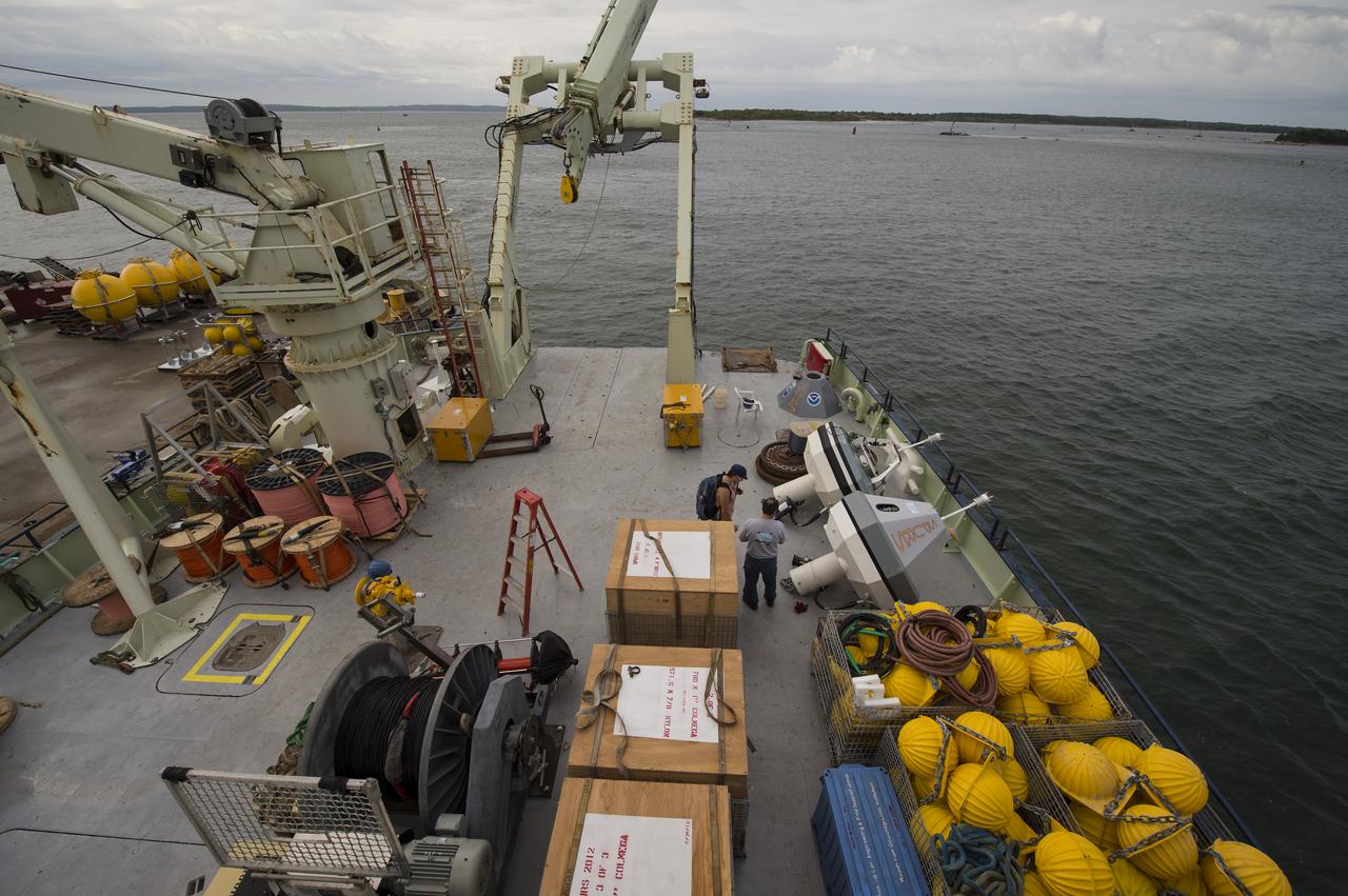 Scientific instruments, buoys, and shipping crates are seen on the stern of the Woods Hole Oceanographic Institution's research vessel Knorr on Tuesday, Sept. 4, 2012, in Woods Hole, Mass.  Knorr is scheduled to depart on Sept. 6 to take part in the Salinity Processes in the Upper Ocean Regional Study (SPURS).  The NASA-sponsored expedition will sail to the North Atlantic's saltiest spot to get a detailed, 3-D picture of how salt content fluctuates in the ocean's upper layers and how these variations are related to shifts in rainfall patterns around the planet.  Photo Credit: (NASA/Bill Ingalls)