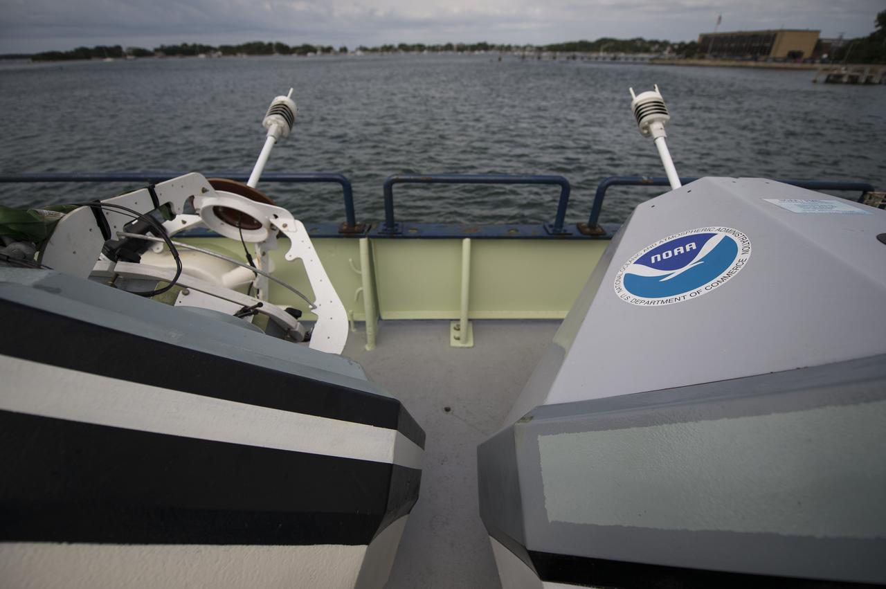 Two NOAA Pacific Marine Environmental Laboratory (PMEL) buoys are seen on the stern of the Woods Hole Oceanographic Institution's research vessel Knorr on Tuesday, Sept. 4, 2012, in Woods Hole, Mass. Knorr is scheduled to depart on Sept. 6 to take part in the Salinity Processes in the Upper Ocean Regional Study (SPURS). The NASA-sponsored expedition will sail to the North Atlantic's saltiest spot to get a detailed, 3-D picture of how salt content fluctuates in the ocean's upper layers and how these variations are related to shifts in rainfall patterns around the planet. Photo Credit: (NASA/Bill Ingalls)