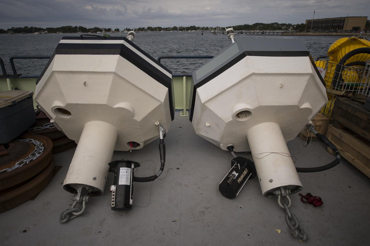Two NOAA Pacific Marine Environmental Laboratory (PMEL) buoys are seen on the stern of the Woods Hole Oceanographic Institution's research vessel Knorr on Tuesday, Sept. 4, 2012, in Woods Hole, Mass. Knorr is scheduled to depart on Sept. 6 to take part in the Salinity Processes in the Upper Ocean Regional Study (SPURS). The NASA-sponsored expedition will sail to the North Atlantic's saltiest spot to get a detailed, 3-D picture of how salt content fluctuates in the ocean's upper layers and how these variations are related to shifts in rainfall patterns around the planet. Photo Credit: (NASA/Bill Ingalls)