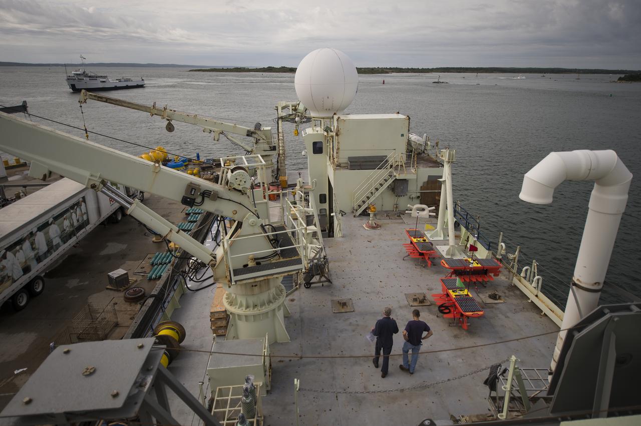 Autonomous wave gliders, right, are seen onboard the the Woods Hole Oceanographic Institution research vessel Knorr on Tuesday, Sept. 4, 2012, in Woods Hole, Mass. The autonomous gliders will be deployed in the Atlantic Ocean as part of the Salinity Processes in the Upper Ocean Regional Study (SPURS) which is set to sail on Sept. 6. The NASA-sponsored expedition will sail to the North Atlantic's saltiest spot to get a detailed, 3-D picture of how salt content fluctuates in the ocean's upper layers and how these variations are related to shifts in rainfall patterns around the planet. Photo Credit: (NASA/Bill Ingalls)