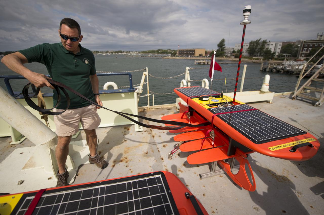 Woods Hole Oceanographic Institution Scientist Dave Fratantoni works on the EcoMapper AUVs (autonomous underwater vehicles) onboard the Institute's research vessel Knorr, Tuesday, Sept. 4, 2012, in Woods Hole, Mass. The EcoMappers will be deployed in the Atlantic Ocean as part of the Salinity Processes in the Upper Ocean Regional Study (SPURS) which is set to sail on Sept. 6. The NASA-sponsored expedition will sail to the North Atlantic's saltiest spot to get a detailed, 3-D picture of how salt content fluctuates in the ocean's upper layers and how these variations are related to shifts in rainfall patterns around the planet. Photo Credit: (NASA/Bill Ingalls)