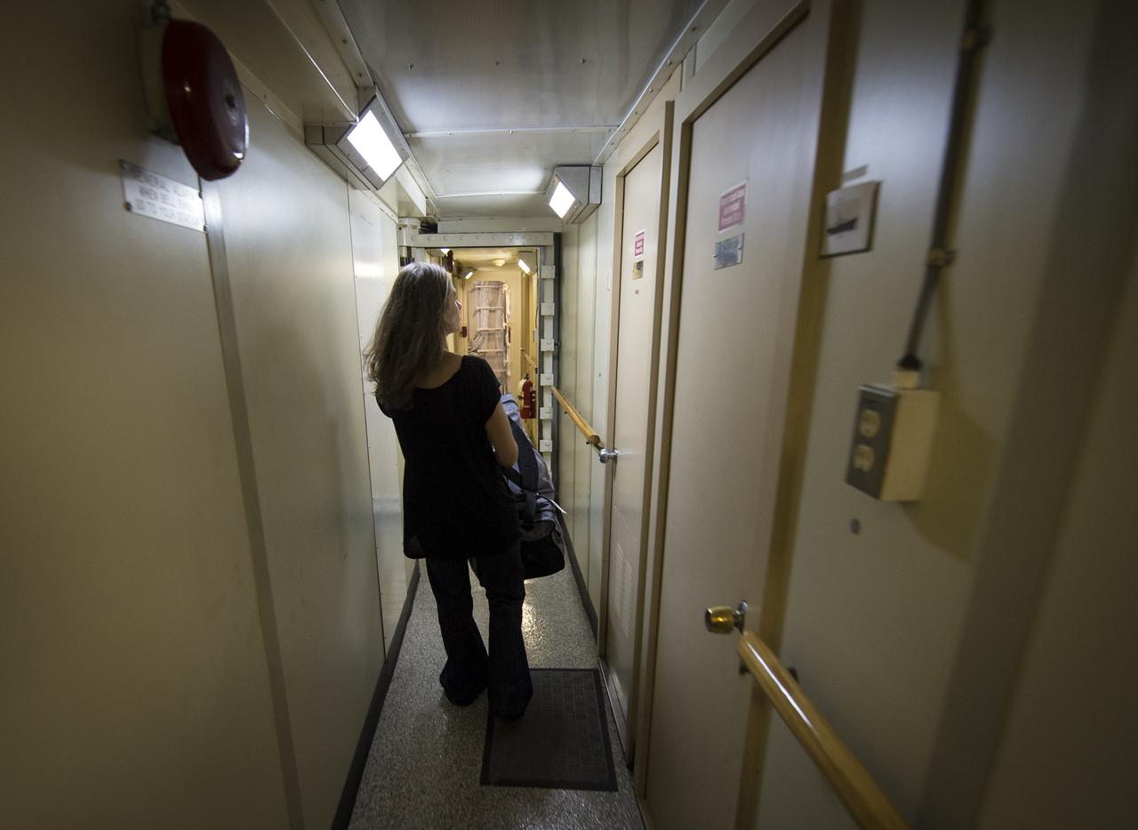 University of Washington Graduate Student Jesse Anderson tries to find her cabin onboard the Woods Hole Oceanographic Institution research vessel Knorr on Tuesday, Sept. 4, 2012, in Woods Hole, Mass. Anderson will work with the Argo Floats instruments in the Atlantic Ocean as part of the Salinity Processes in the Upper Ocean Regional Study (SPURS) which is set to sail on Sept. 6. The NASA-sponsored expedition will sail to the North Atlantic's saltiest spot to get a detailed, 3-D picture of how salt content fluctuates in the ocean's upper layers and how these variations are related to shifts in rainfall patterns around the planet. Photo Credit: (NASA/Bill Ingalls)