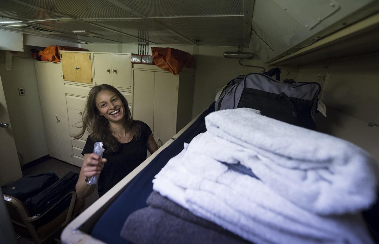 University of Washington Graduate Student Jesse Anderson settles into her cabin onboard the Woods Hole Oceanographic Institution research vessel Knorr on Tuesday, Sept. 4, 2012, in Woods Hole, Mass. Anderson will work with the Argo Floats instruments in the Atlantic Ocean as part of the Salinity Processes in the Upper Ocean Regional Study (SPURS) which is set to sail on Sept. 6. The NASA-sponsored expedition will sail to the North Atlantic's saltiest spot to get a detailed, 3-D picture of how salt content fluctuates in the ocean's upper layers and how these variations are related to shifts in rainfall patterns around the planet. Photo Credit: (NASA/Bill Ingalls)
