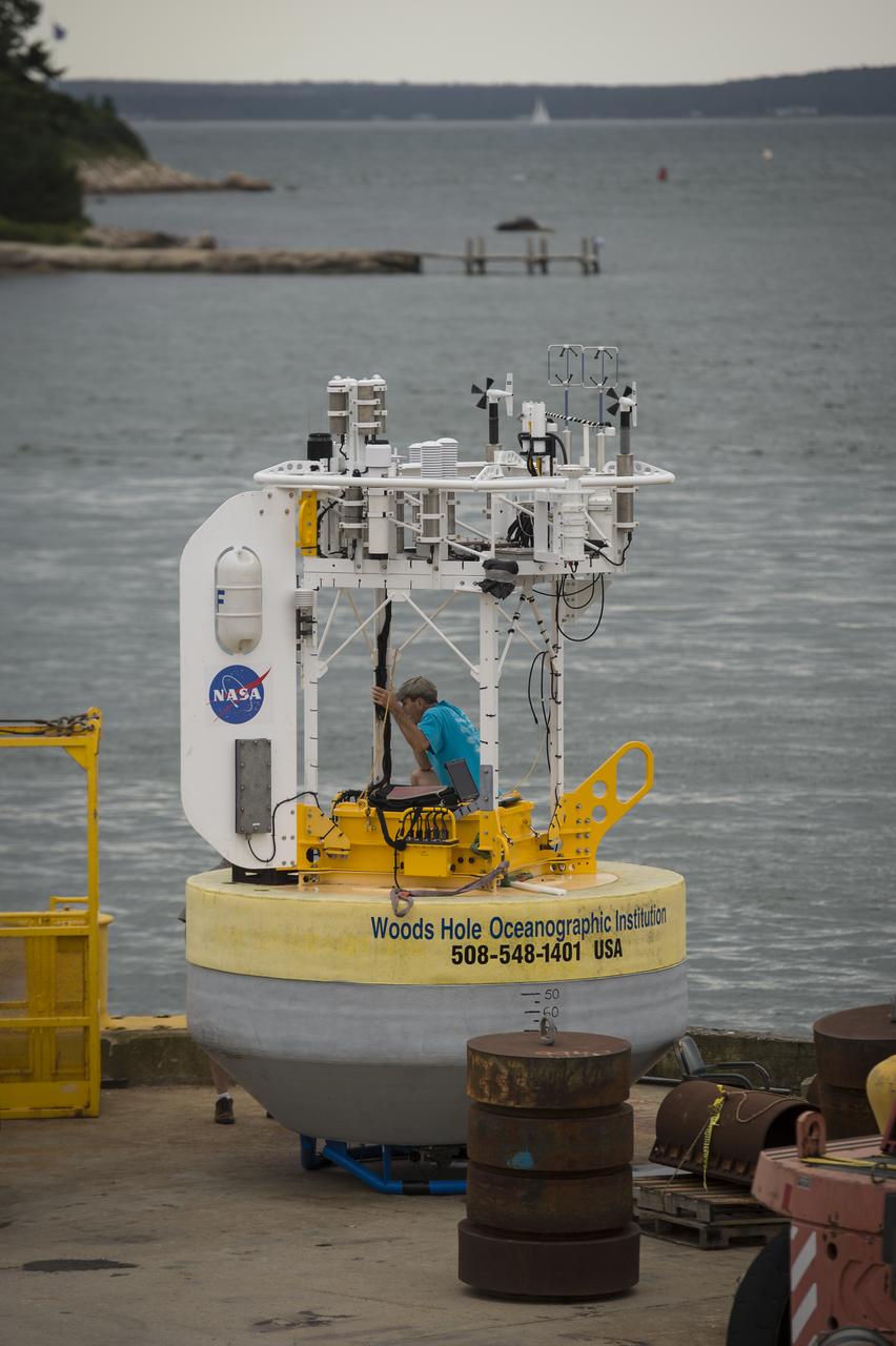 Woods Hole Oceanographic Institution Senior Engineer Steve Faluotico works on the SPURS buoy prior to it being loaded onto the Institute's research vessel Knorr, Tuesday, Sept. 4, 2012, in Woods Hole, Mass. The SPURS buoy will be deployed in the Atlantic Ocean as part of the Salinity Processes in the Upper Ocean Regional Study (SPURS) which is set to sail on Sept. 6. The NASA-sponsored expedition will sail to the North Atlantic's saltiest spot to get a detailed, 3-D picture of how salt content fluctuates in the ocean's upper layers and how these variations are related to shifts in rainfall patterns around the planet. Photo Credit: (NASA/Bill Ingalls)