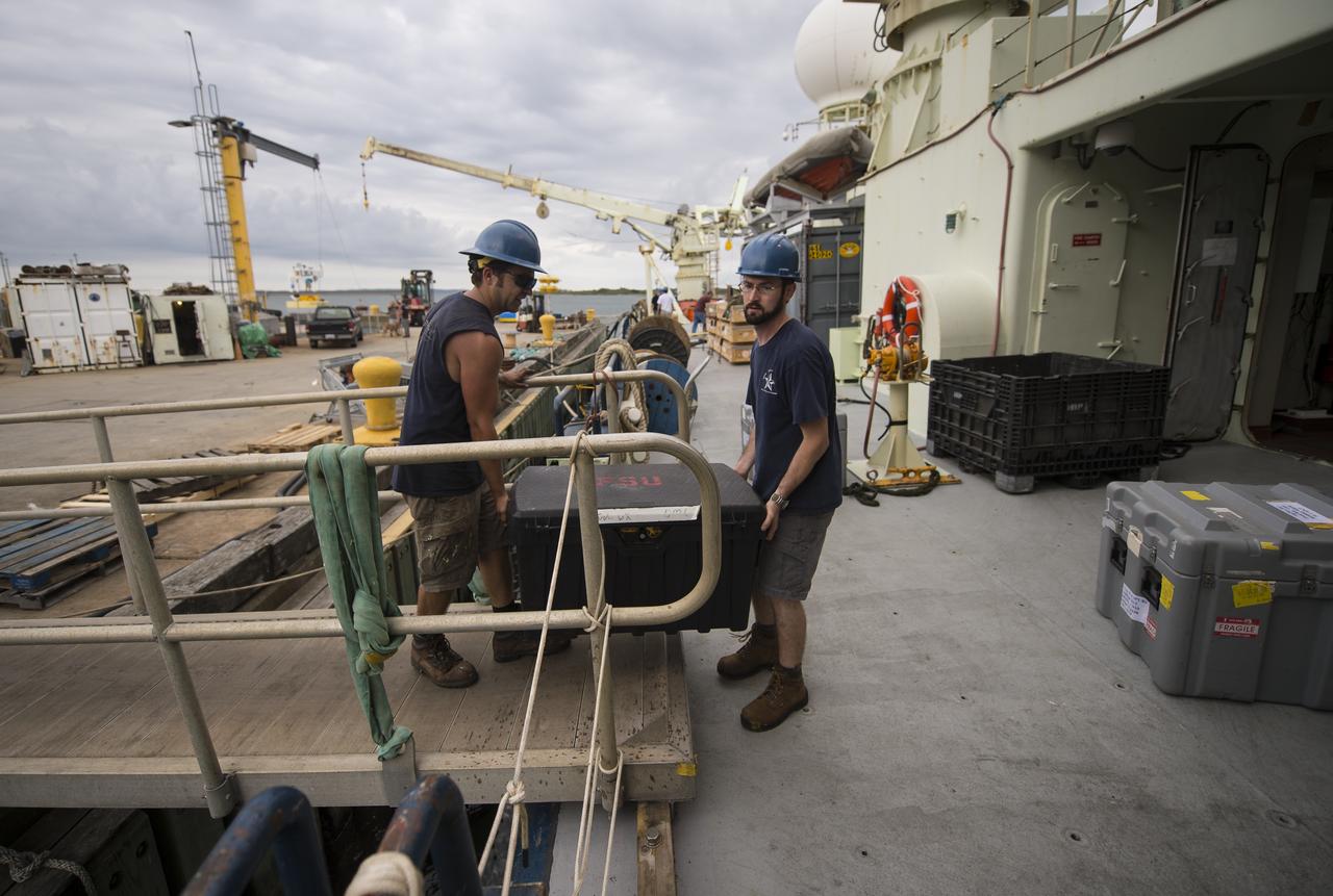 Woods Hole Oceanographic Institution workers load scientific instruments onboard the Institution's research vessel Knorr on Tuesday, Sept. 4, 2012, in Woods Hole, Mass. Knorr is scheduled to depart on Sept. 6 to take part in the Salinity Processes in the Upper Ocean Regional Study (SPURS). The NASA-sponsored expedition will sail to the North Atlantic's saltiest spot to get a detailed, 3-D picture of how salt content fluctuates in the ocean's upper layers and how these variations are related to shifts in rainfall patterns around the planet. Photo Credit: (NASA/Bill Ingalls)