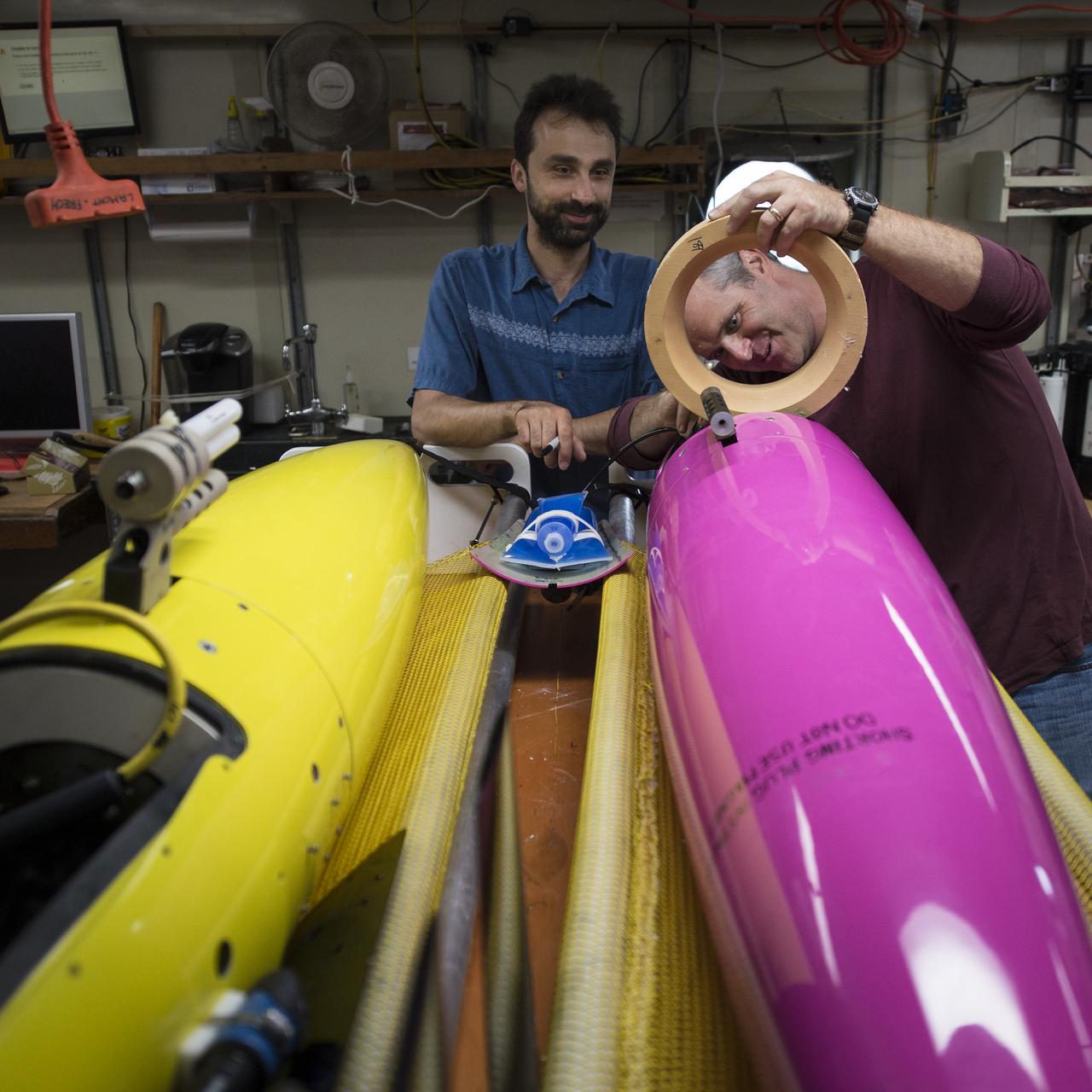 University of Washington Applied Physics Laboratory Senior Oceanographer Andrey Shcherbina, left, and University of Washington Applied Physics Laboratory Senior Principal Oceanographer Jason Gobat work one of their instruments onboard the Woods Hole Oceanographic Institution's research vessel Knorr on Tuesday, Sept. 4, 2012, in Woods Hole, Mass.  Knorr is scheduled to depart on Sept. 6 to take part in the Salinity Processes in the Upper Ocean Regional Study (SPURS).  The NASA-sponsored expedition will sail to the North Atlantic's saltiest spot to get a detailed, 3-D picture of how salt content fluctuates in the ocean's upper layers and how these variations are related to shifts in rainfall patterns around the planet.  Photo Credit: (NASA/Bill Ingalls)