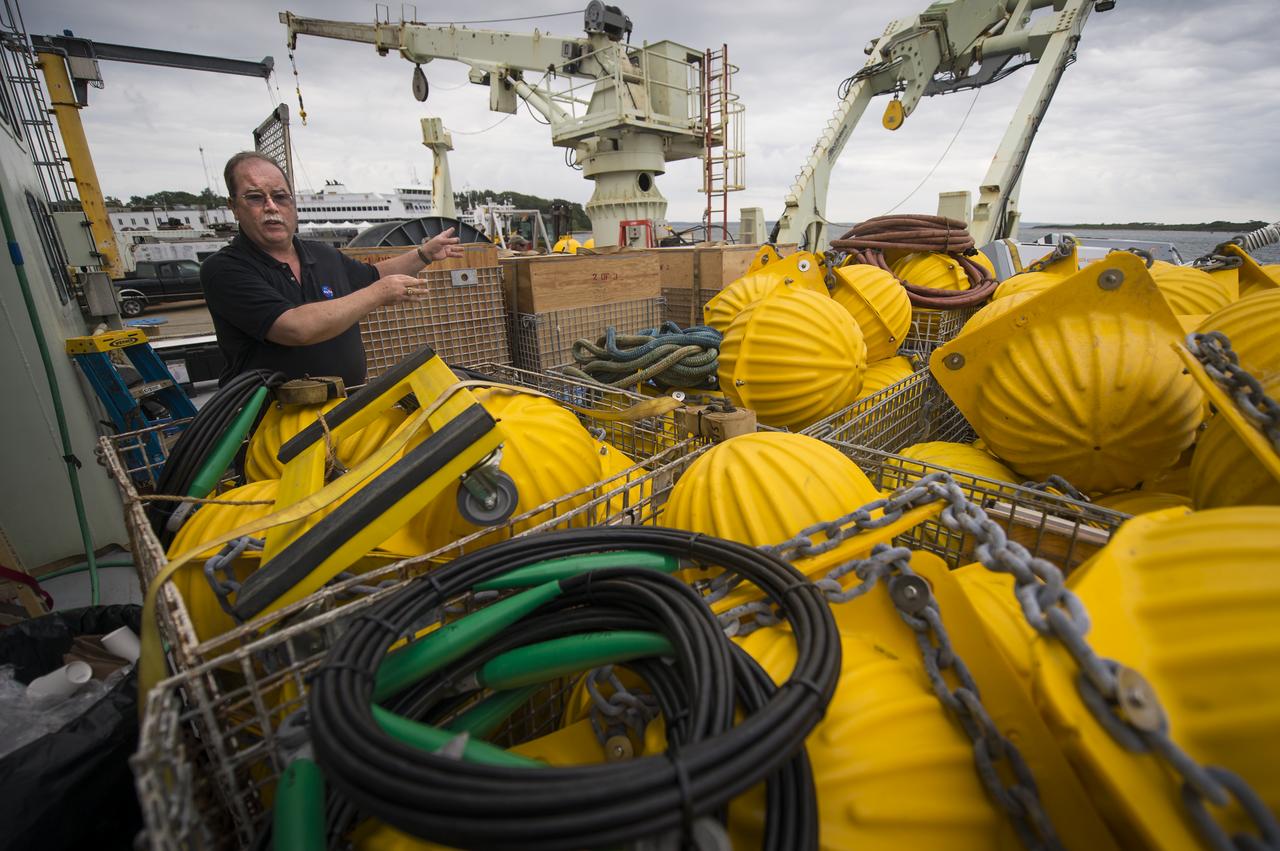 NASA Physical Oceanography Program Scientist Eric Lindstrom talks about the instruments onboard the Woods Hole Oceanographic Institution research vessel Knorr on Tuesday, Sept. 4, 2012, in Woods Hole, Mass. Various scientific instruments will be deployed in the Atlantic Ocean as part of the Salinity Processes in the Upper Ocean Regional Study (SPURS) which is set to sail on Sept. 6. The NASA-sponsored expedition will sail to the North Atlantic's saltiest spot to get a detailed, 3-D picture of how salt content fluctuates in the ocean's upper layers and how these variations are related to shifts in rainfall patterns around the planet. Photo Credit: (NASA/Bill Ingalls)