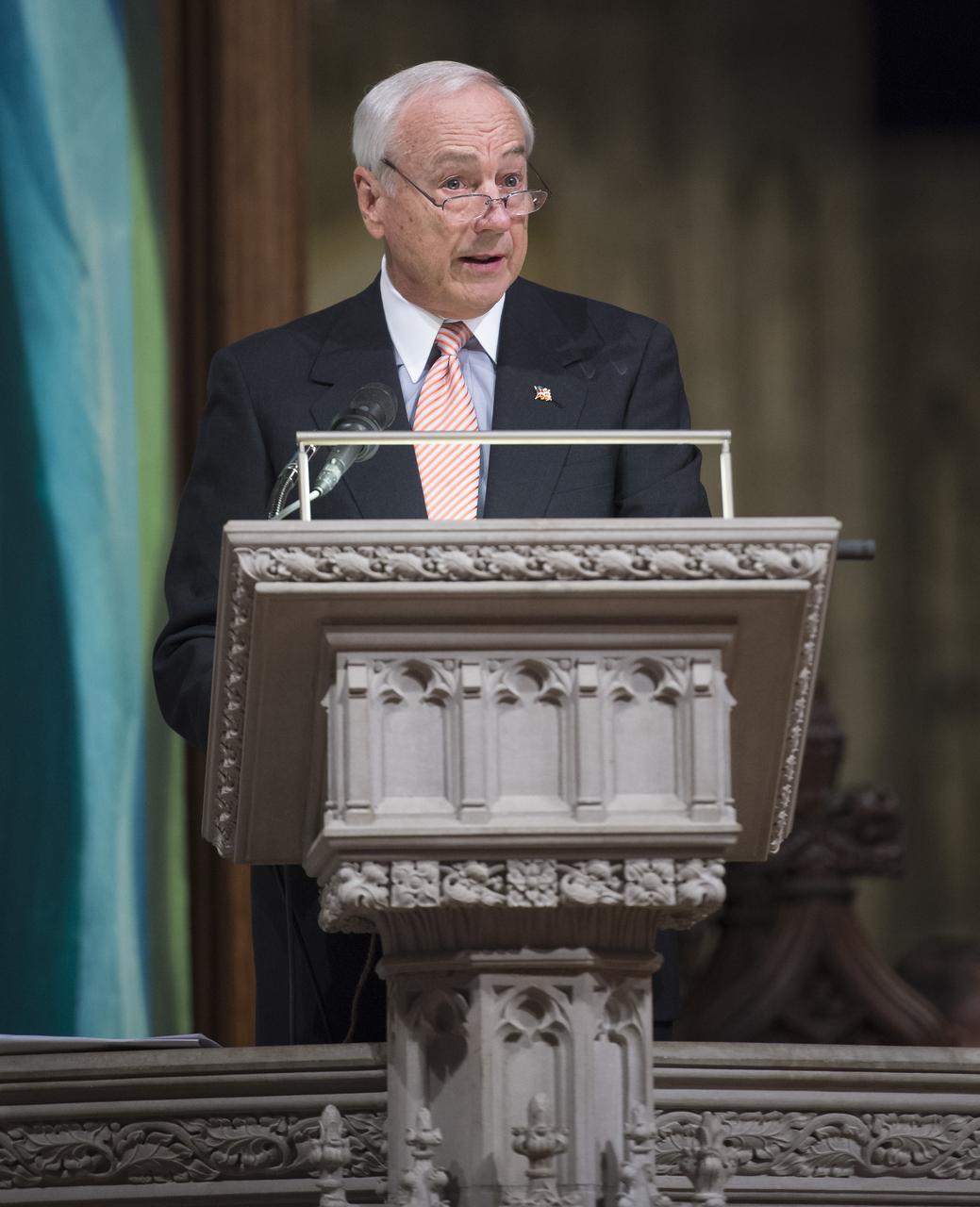 John H. Dalton, former United States Secretary of the Navy, delivers the Reading during a memorial service celebrating the life of Neil Armstrong at the Washington National Cathedral, Thursday, Sept. 13, 2012. Armstrong, the first man to walk on the moon during the 1969 Apollo 11 mission, died Saturday, Aug. 25. He was 82. Photo Credit: (NASA/Bill Ingalls)