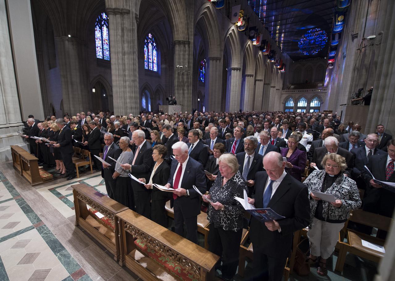 Attendees to the memorial service for Neil Armstrong sing a hymnal, Thursday, Sept. 13, 2012, at the Washington National Cathedral. Armstrong, the first man to walk on the moon during the 1969 Apollo 11 mission, died Saturday, Aug. 25. He was 82. Photo Credit: (NASA/Bill Ingalls)