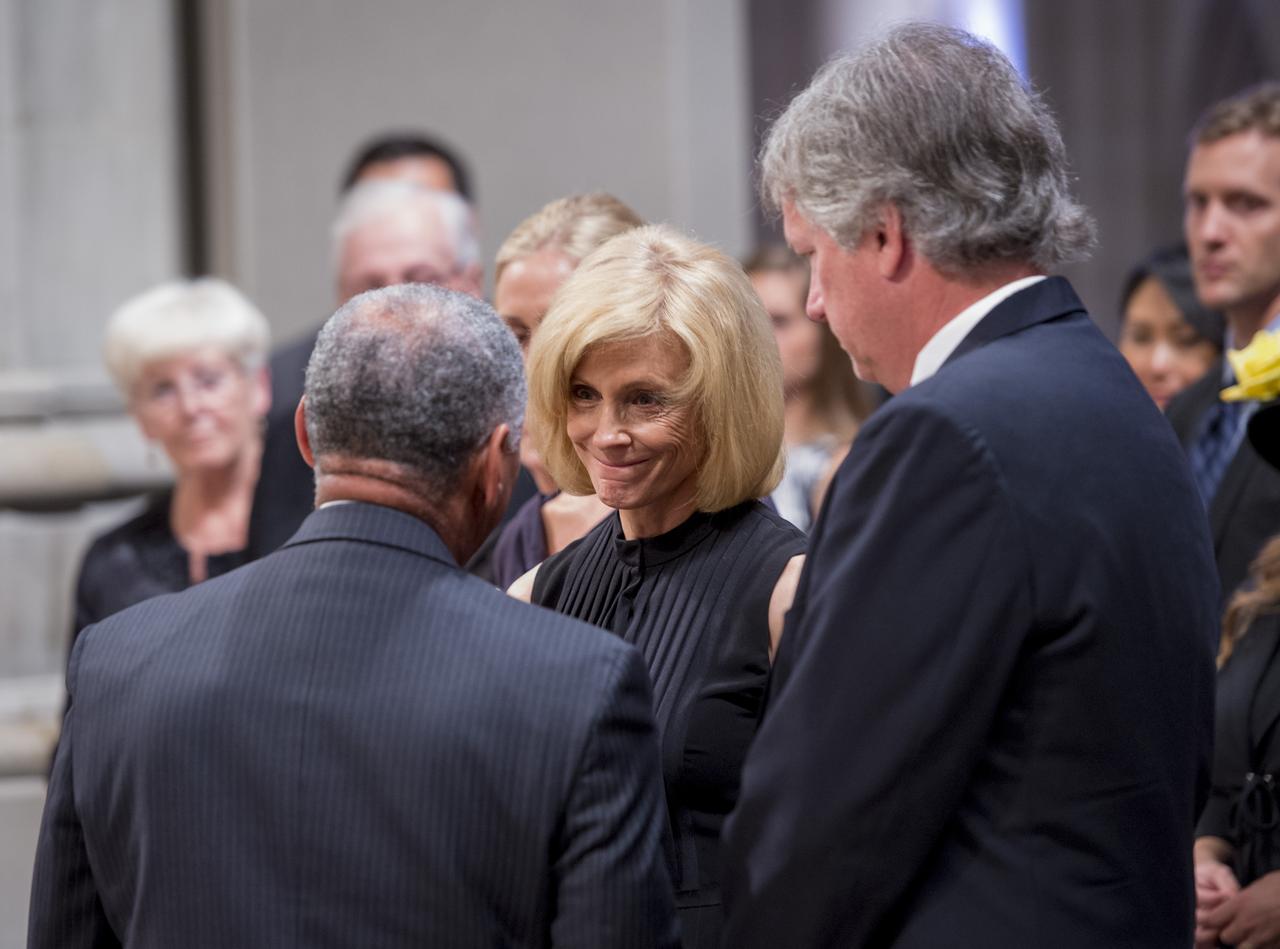 NASA Administrator Charles Bolden, back to camera, speaks with Carol Armstrong after presenting her with a U.S. Flag that was flown at half-mast over Mission Control at Johnson Space Center in Houston, on the day of her husband’s passing, during a memorial service celebrating the life of Neil Armstrong at the Washington National Cathedral, Thursday, Sept. 13, 2012. Armstrong, the first man to walk on the moon during the 1969 Apollo 11 mission, died Saturday, Aug. 25. He was 82. Photo Credit: (NASA/Bill Ingalls)