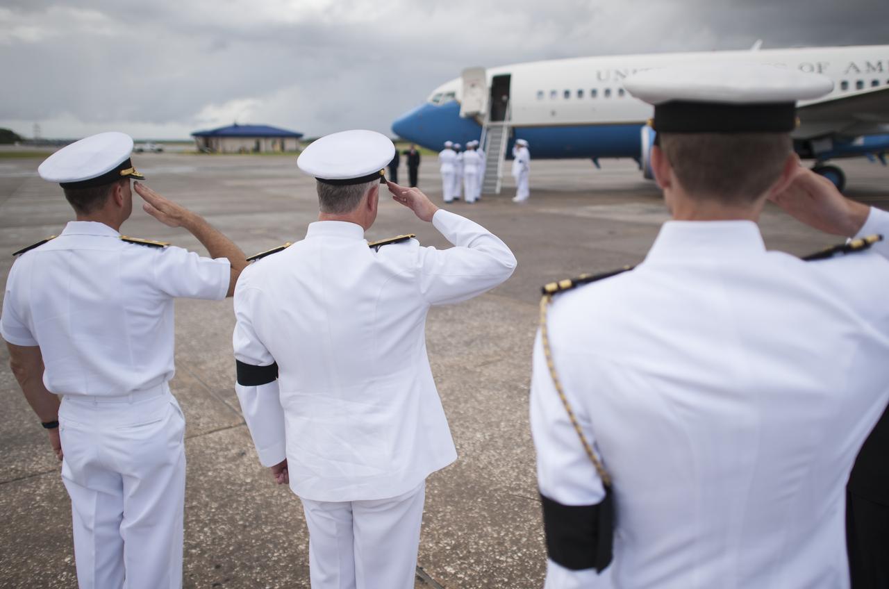 US Navy personnel salute as the cremains of Apollo 11 astronaut Neil Armstrong are transferred from a military aircraft at Naval Station Mayport the day before the Armstrong burial at sea service, Thursday, Sept. 13, 2012, Mayport, Fla. Armstrong, the first man to walk on the moon during the 1969 Apollo 11 mission, died Saturday, Aug. 25. He was 82. Photo Credit: (NASA/Bill Ingalls)