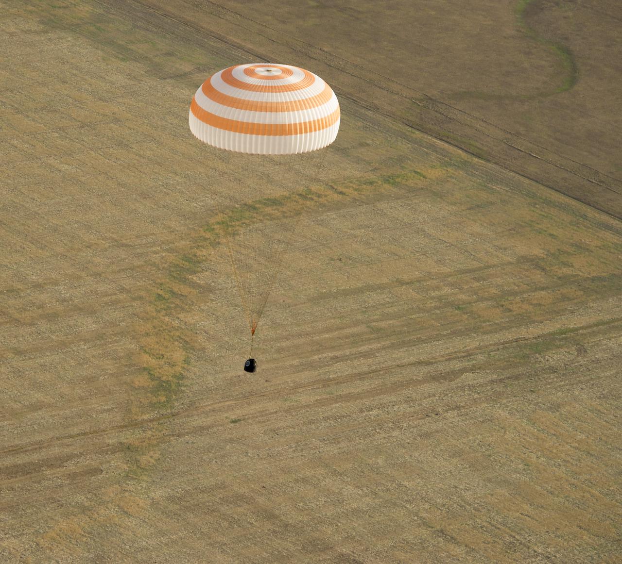The Soyuz TMA-04M spacecraft is seen as it lands with Expedition 32 Commander Gennady Padalka of Russia, NASA Flight Engineer Joe Acaba and Russian Flight Engineer Sergei Revin in a remote area near the town of Arkalyk, Kazakhstan, on Monday, September 17, 2012.  Padalka, Acaba and Revin returned from five months onboard the International Space Station where they served as members of the Expedition 31 and 32 crews. Photo Credit:  (NASA/Carla Cioffi)