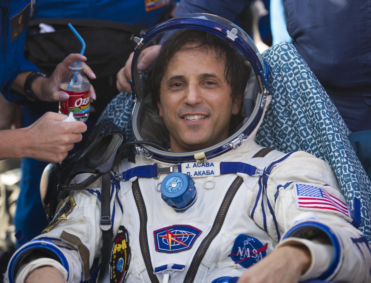 Expedition 32 NASA Flight Engineer Joe Acaba is seen as he rests outside the Soyuz TMA-04M capsule just minutes after he and Expedition 32 Soyuz Commander Gennady Padalka and Russian Flight Engineer Sergei Revin landed in a remote area outside of the town of Arkalyk, Kazakhstan, on Monday, Sept. 17, 2012. NASA Astronaut Acaba, Russian Cosmonauts Padalka and Revin are returning from five months onboard the International Space Station where they served as members of the Expedition 31 and 32 crews. Photo Credit: (NASA/Carla Cioffi)